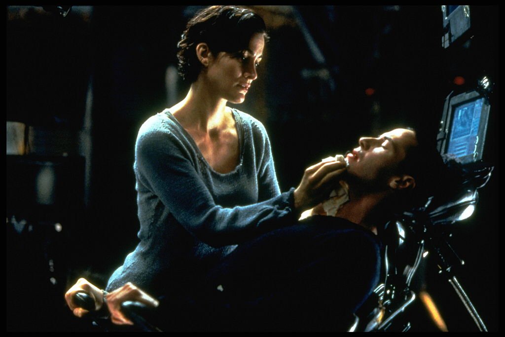 Carrie-Anne Moss and Keanu Reeves in The Matrix. | Source: Getty Images