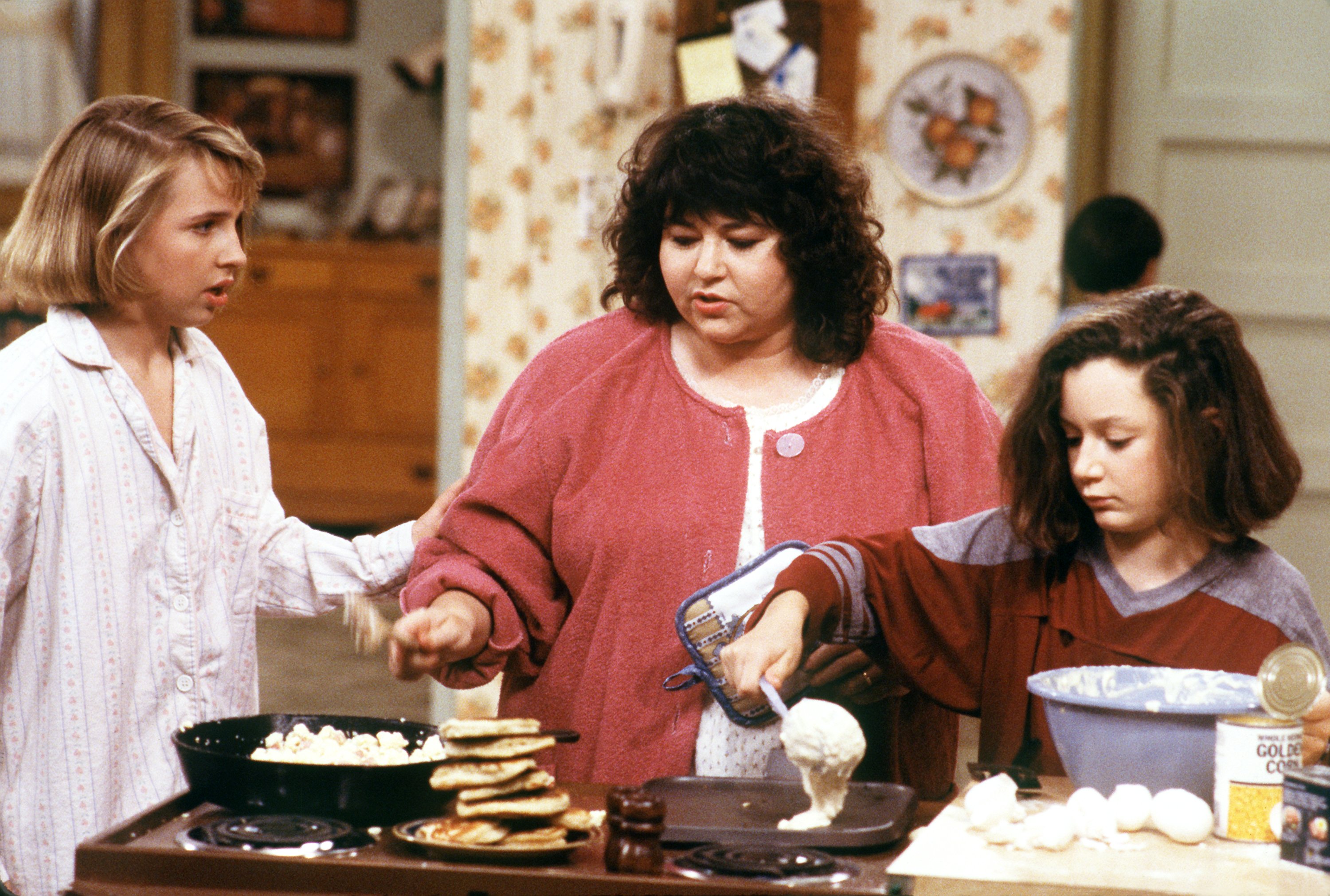 Becky (Lecy Goranson), Roseanne (Roseanne Barr) and Darlene (Sara Gilbert) prepared a birthday breakfast for Dan on set of ROSEANNE.
