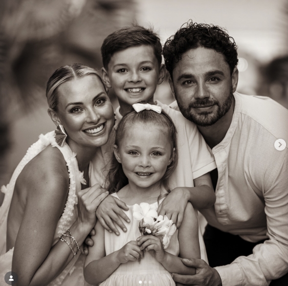 Captured on 16 June 2024, Caroline and Adam Thomas pose alongside their two children in a beautifully composed family portrait, their close embrace and warm smiles reflecting a strong sense of unity and pride. | Source: Instagram/carolinethomas23