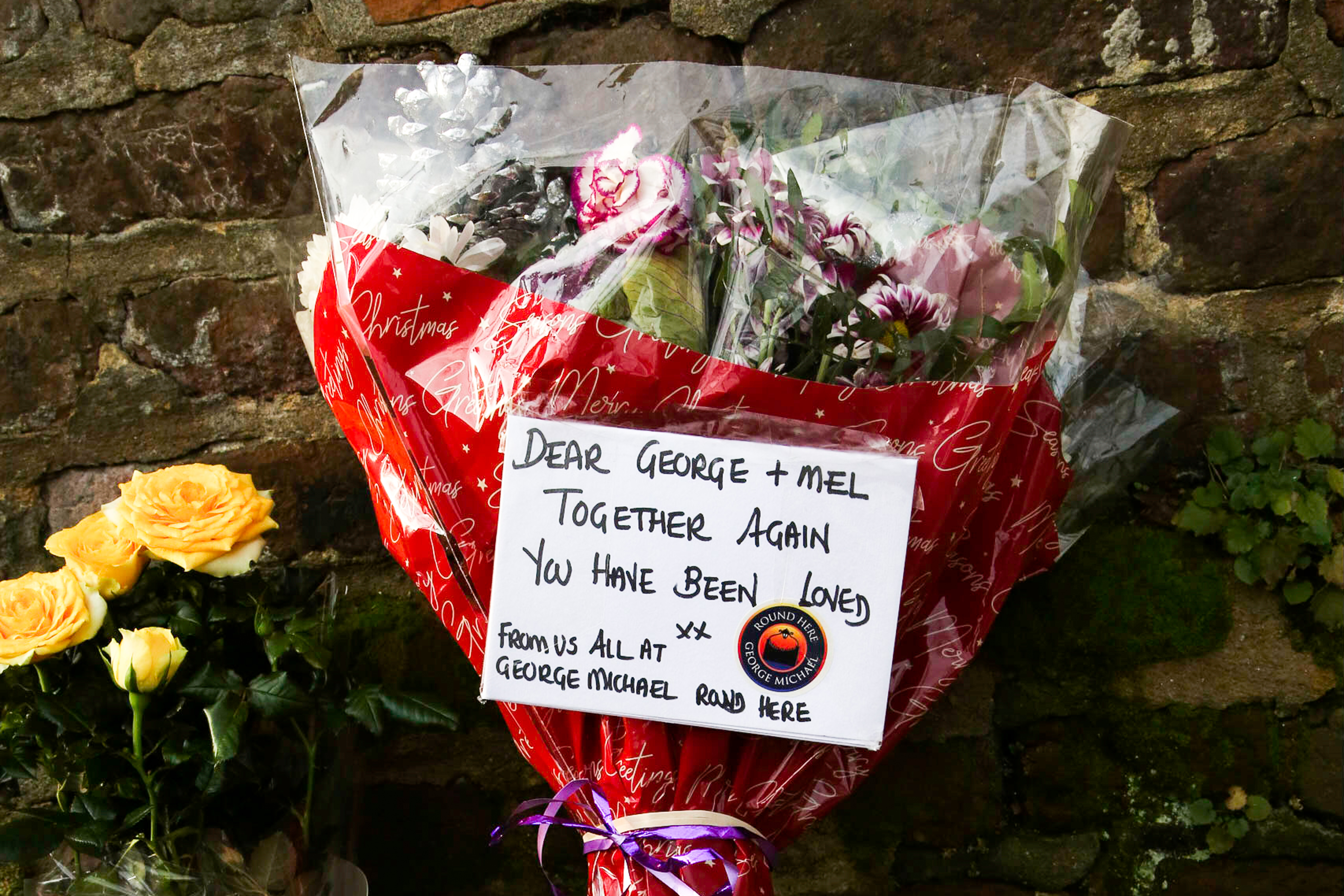 Tributes in memory of Melanie Panayiotou outside George Michael's former house on December 29, 2019 in Highgate, north London, England | Source: Getty Images