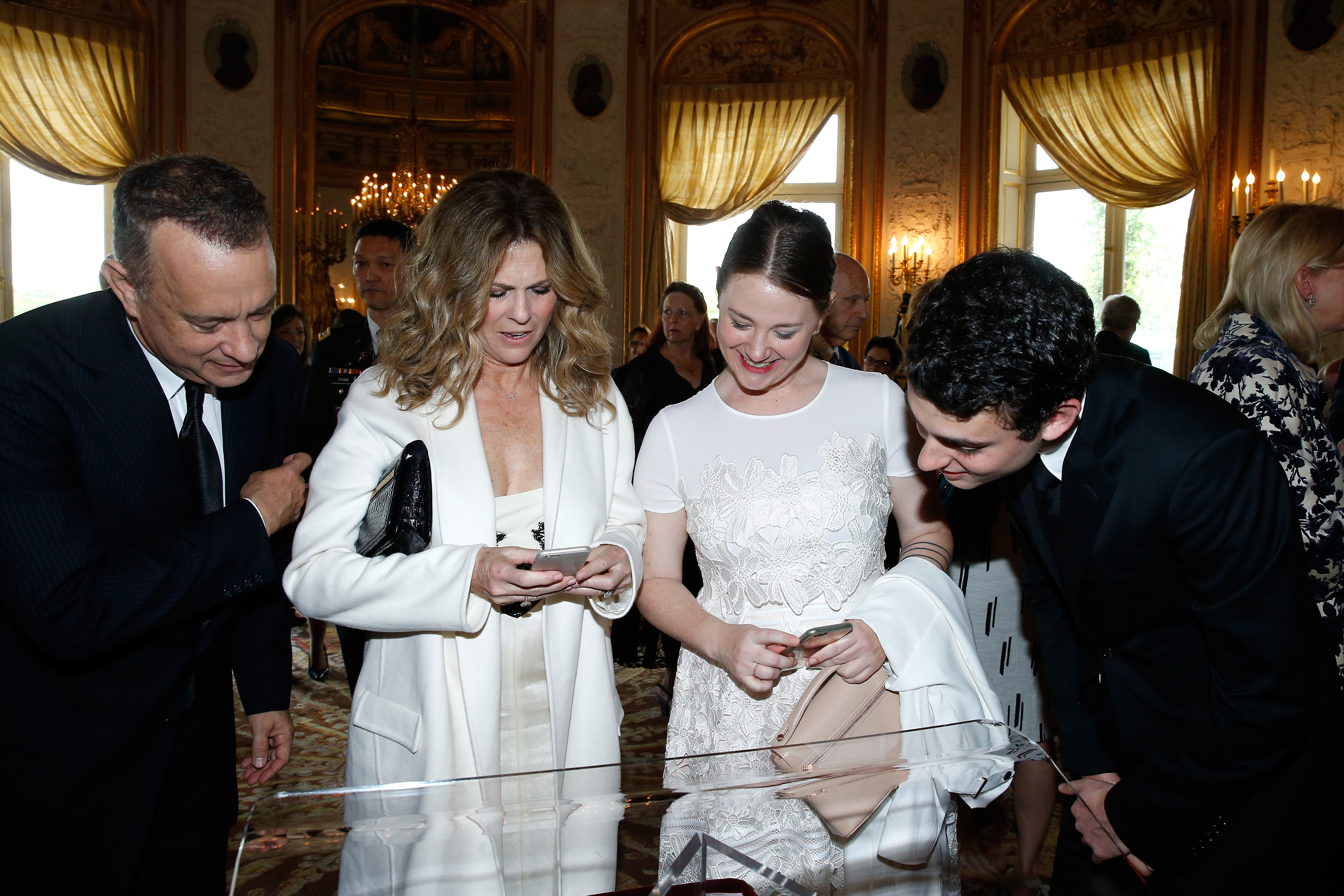 Tom, Rita Wilson, Truman, and Elizabeth Hanks attend Tom Hanks, Tom Brokaw & Gordon "Nick" Mueller receive the Legion d'Honneur Medal on May 19, 2016, in Paris, France. | Source: Getty Images