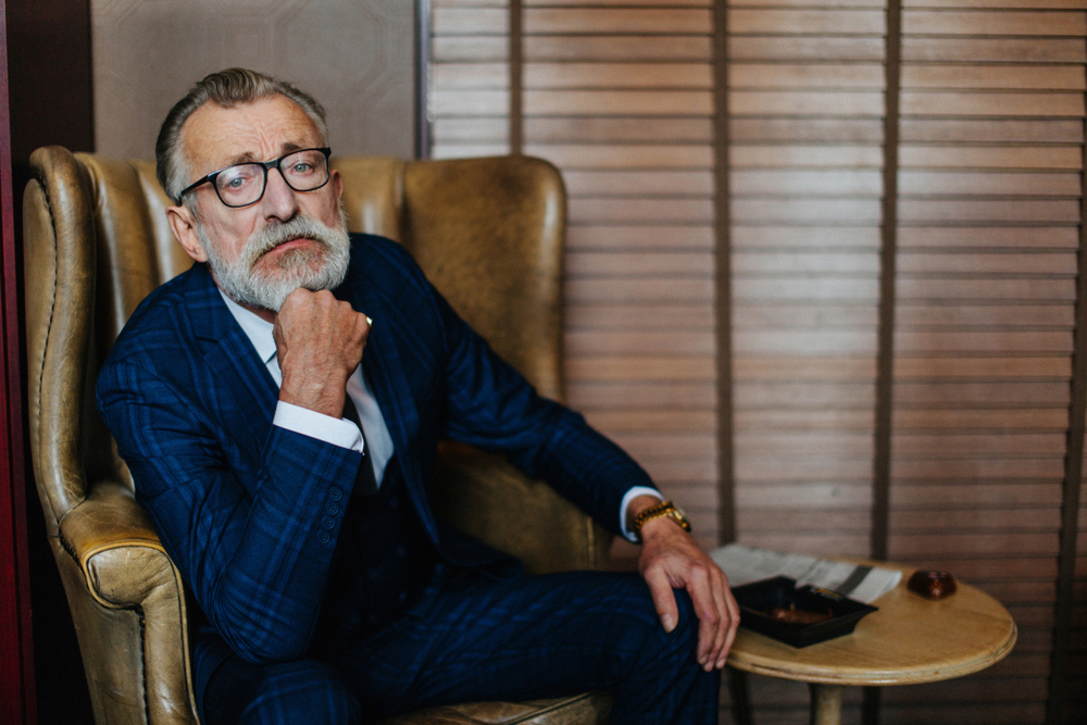Grandpa in glasses and formal suit | Source: Shutterstock.com