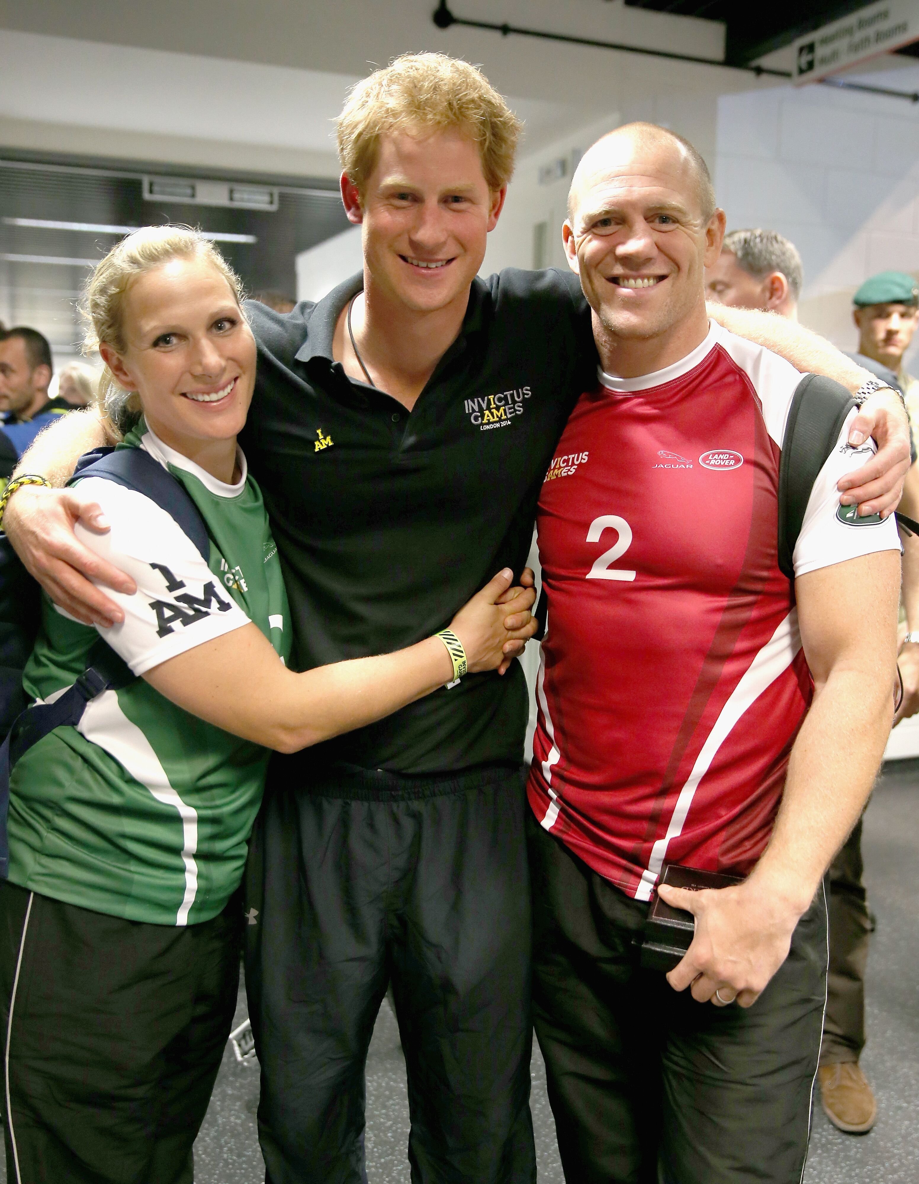 Zara Phillips, Prince Harry and Mike Tindall pose for a photograph after competing in an Exhibition wheelchair rugby match at the Copper Box. | Source: Getty Images