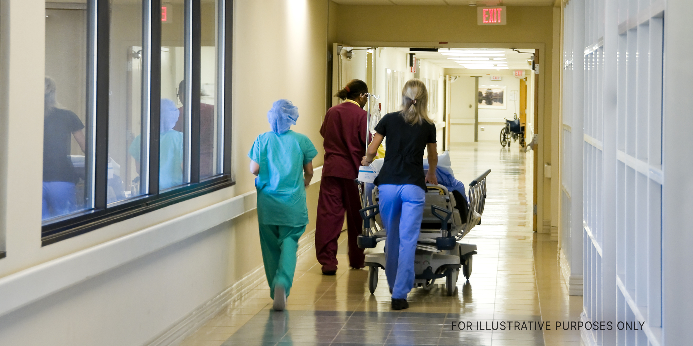 Hospital staff taking patient to the ward | Source: Shutterstock