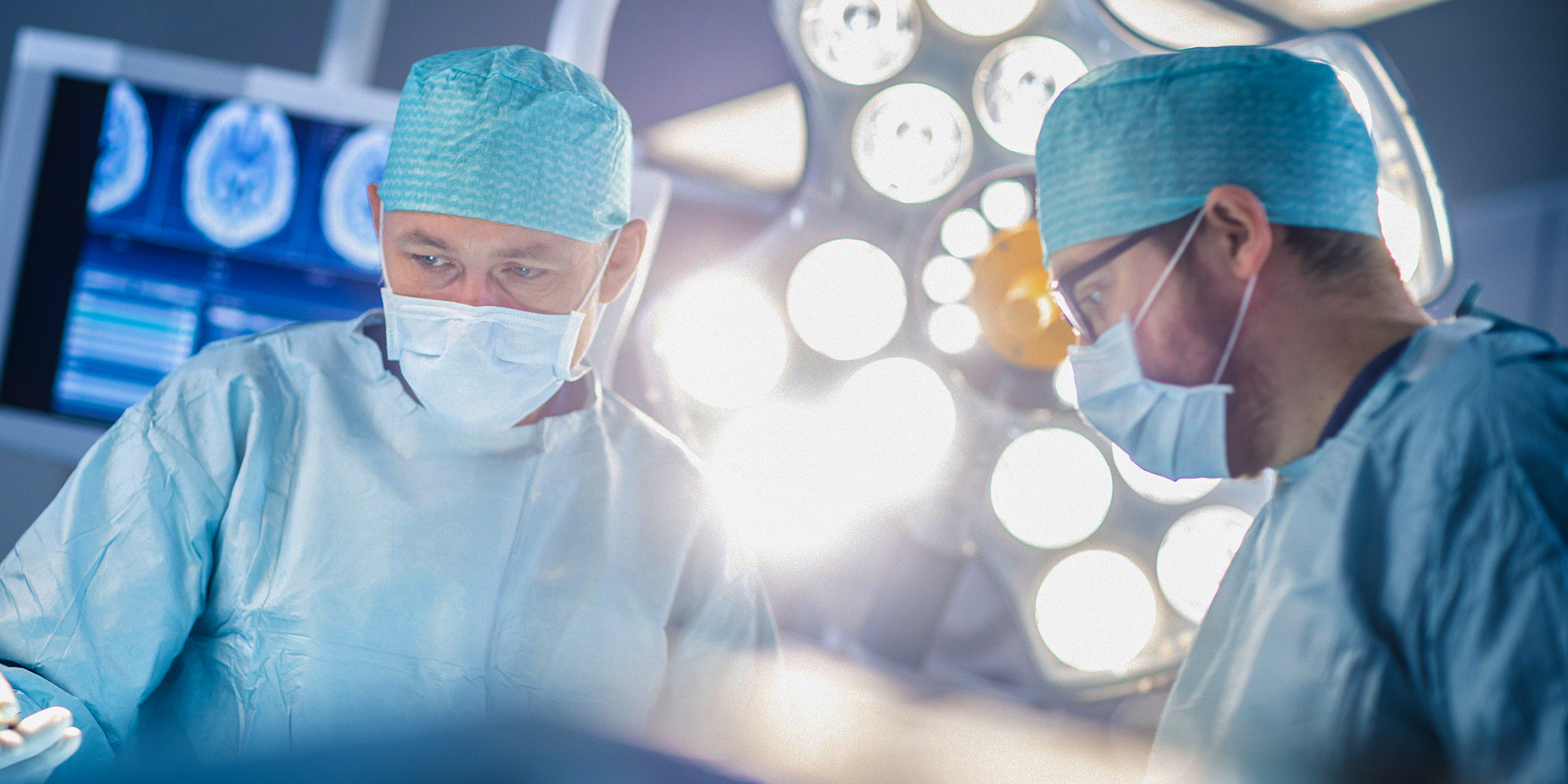 Doctors in an operating theatre | Source: Shutterstock