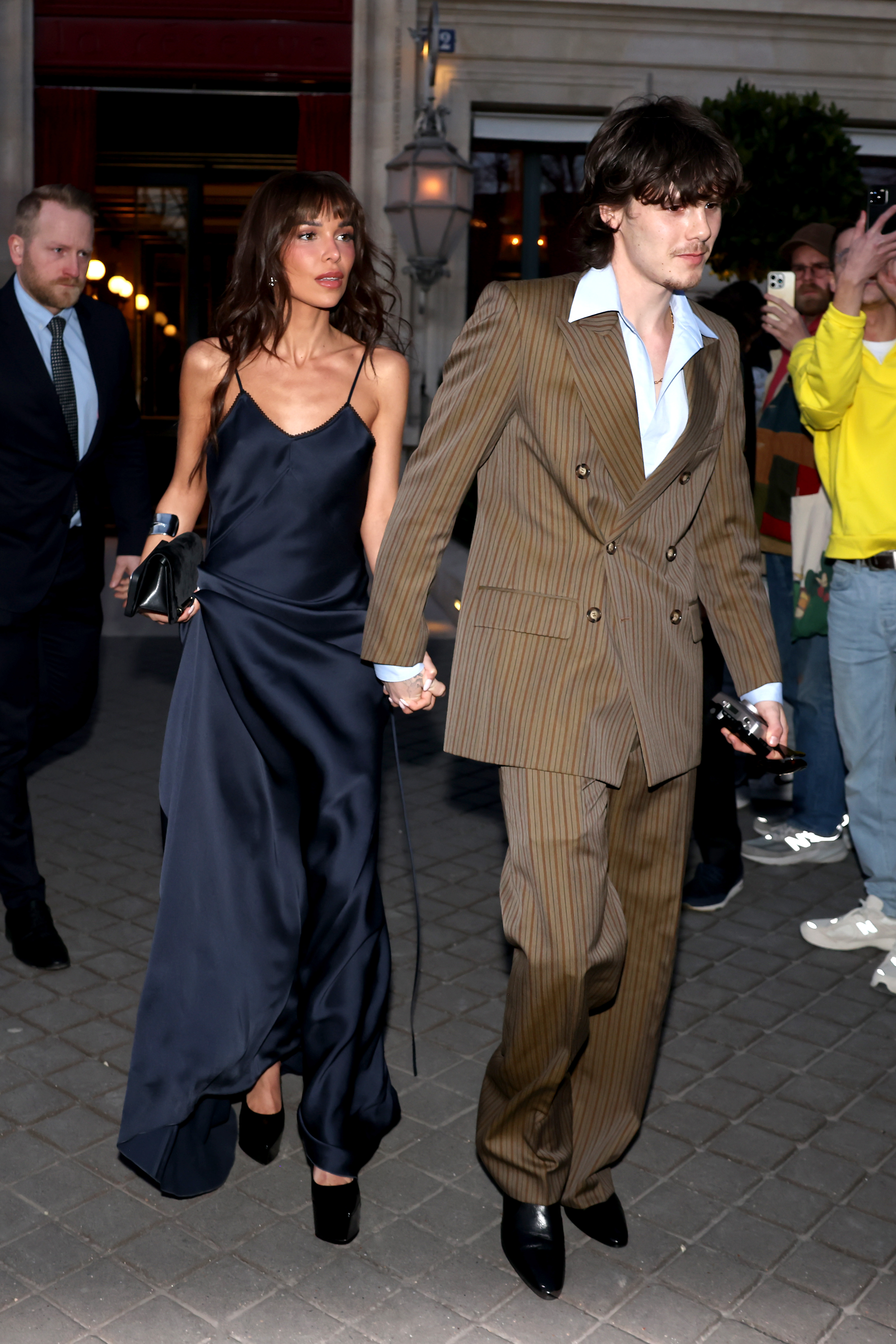 All eyes on them — The lovebirds are seen walking hand in hand through Paris, as the city buzzes with Fashion Week excitement.