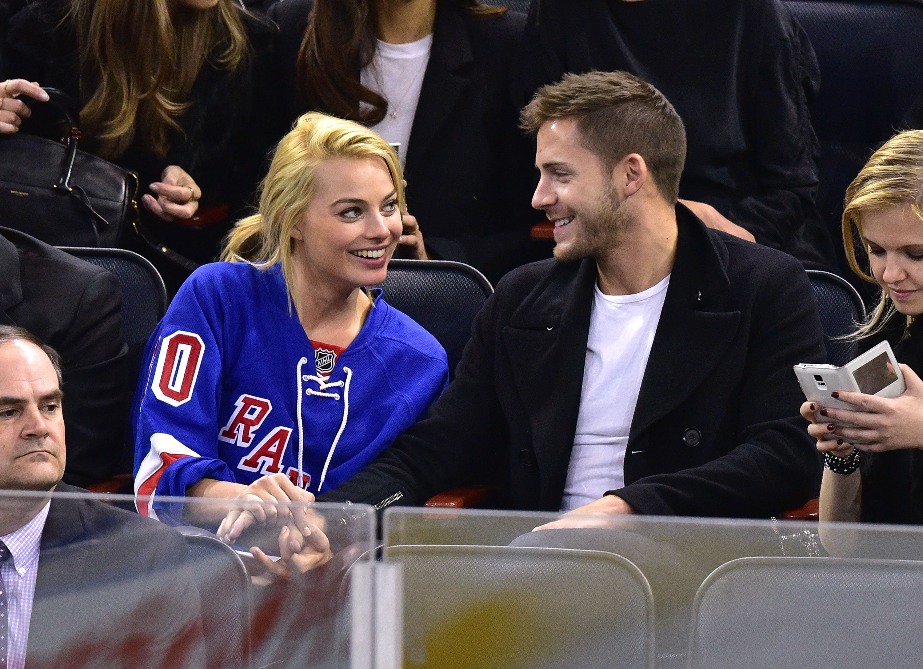 Margot Robbie and her husband Tom Ackerley attend the Arizona Coyotes vs. New York Rangers game at Madison Square Garden on February 26, 2015, in New York City. | Source: Getty Images 