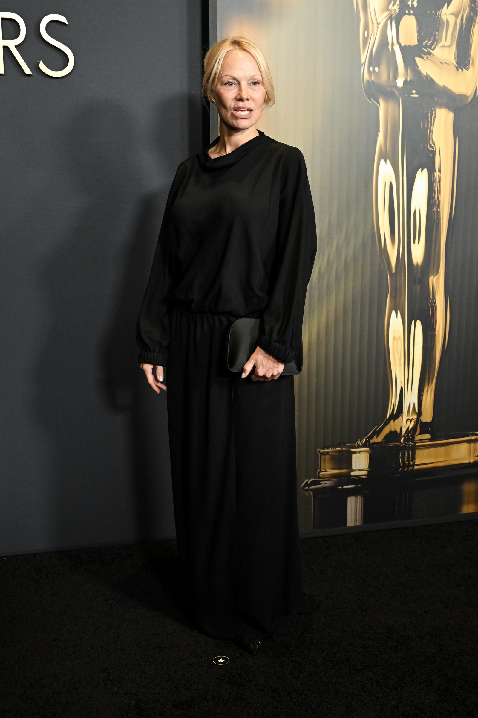 Pamela Anderson poses for the cameras at the 15th Governors Awards on November 17, 2024, in Los Angeles, California. | Source: Getty Images