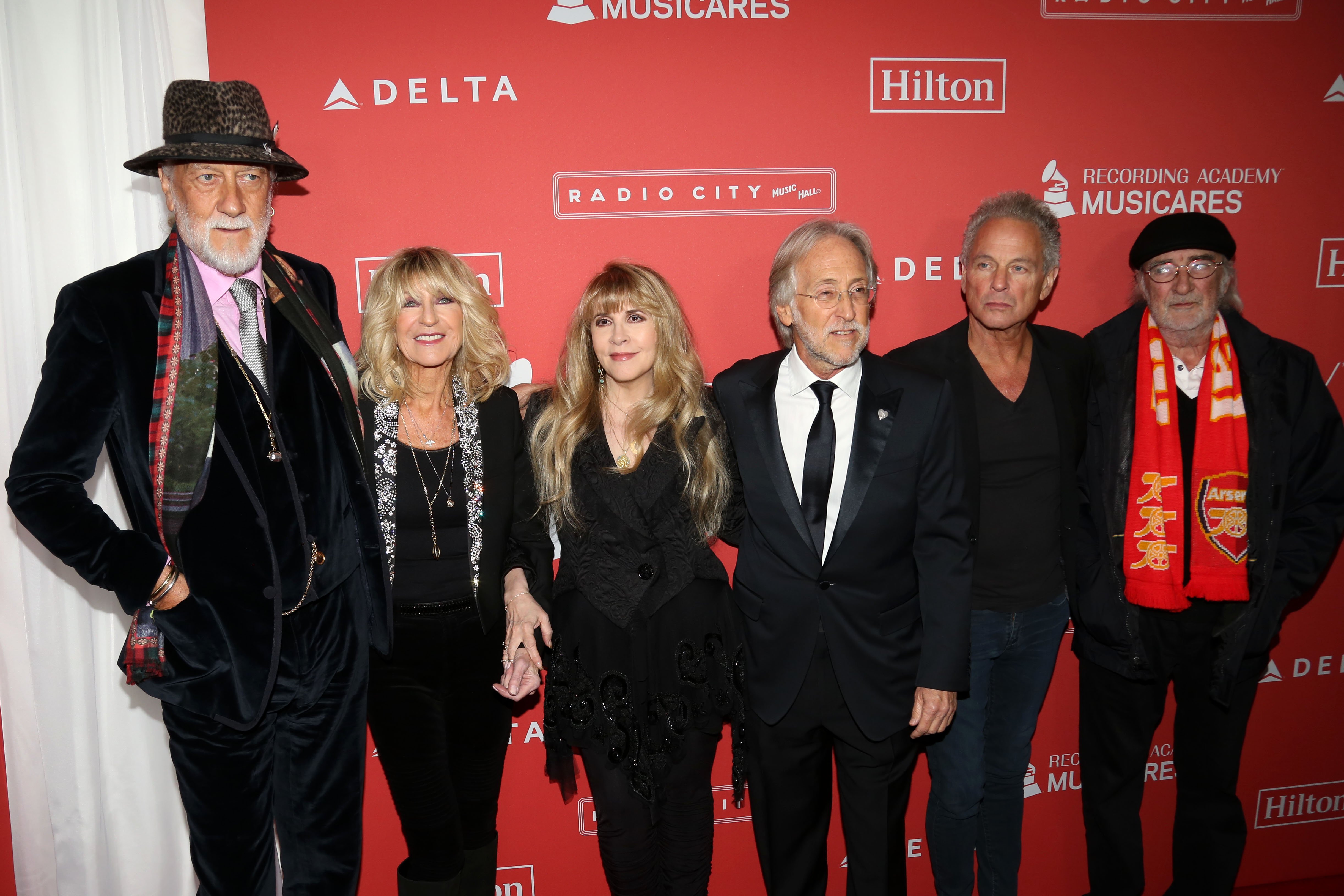 Mick Fleetwood, Christine McVie, Stevie Nicks, Recording Academy President and CEO Neil Portnow, Lindsey Buckingham, and John McVie of Fleetwood Mac at the 2018 MusiCares Person of the Year event on January 26, 2018 | Source: Getty Images