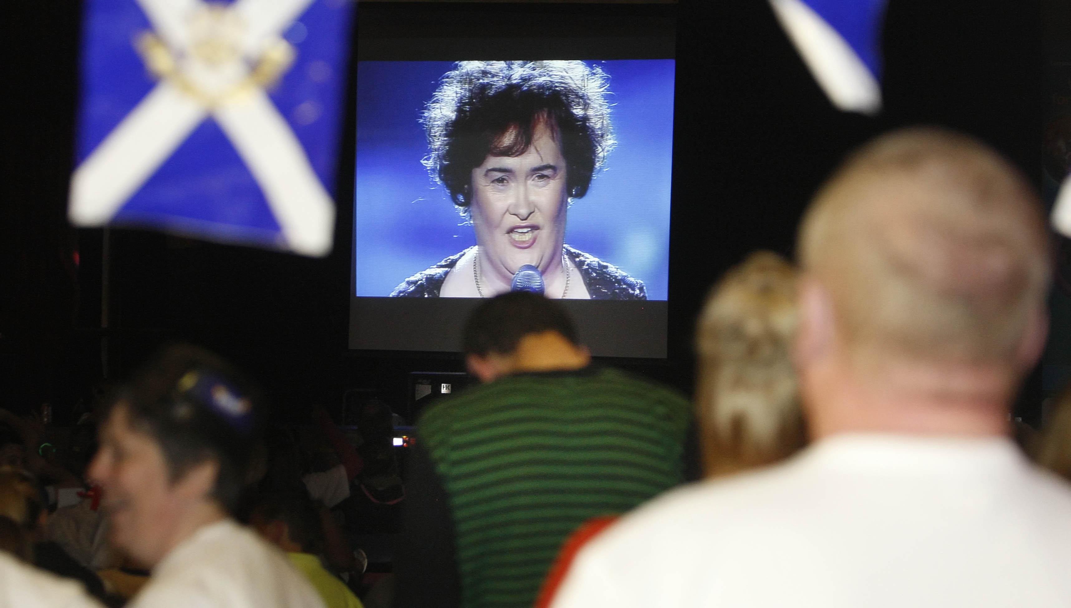 Fans gather to watch Susan Boyle perform in the Britain's Got Talent live semi-final on a large screen in the community center in her home town of Blackburn, West Lothian. | Source: Getty Images