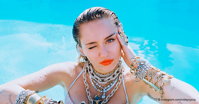 Miley Cyrus Celebrates Friday in Barely-There Bikini and a Jacket Slipping off Her Shoulders