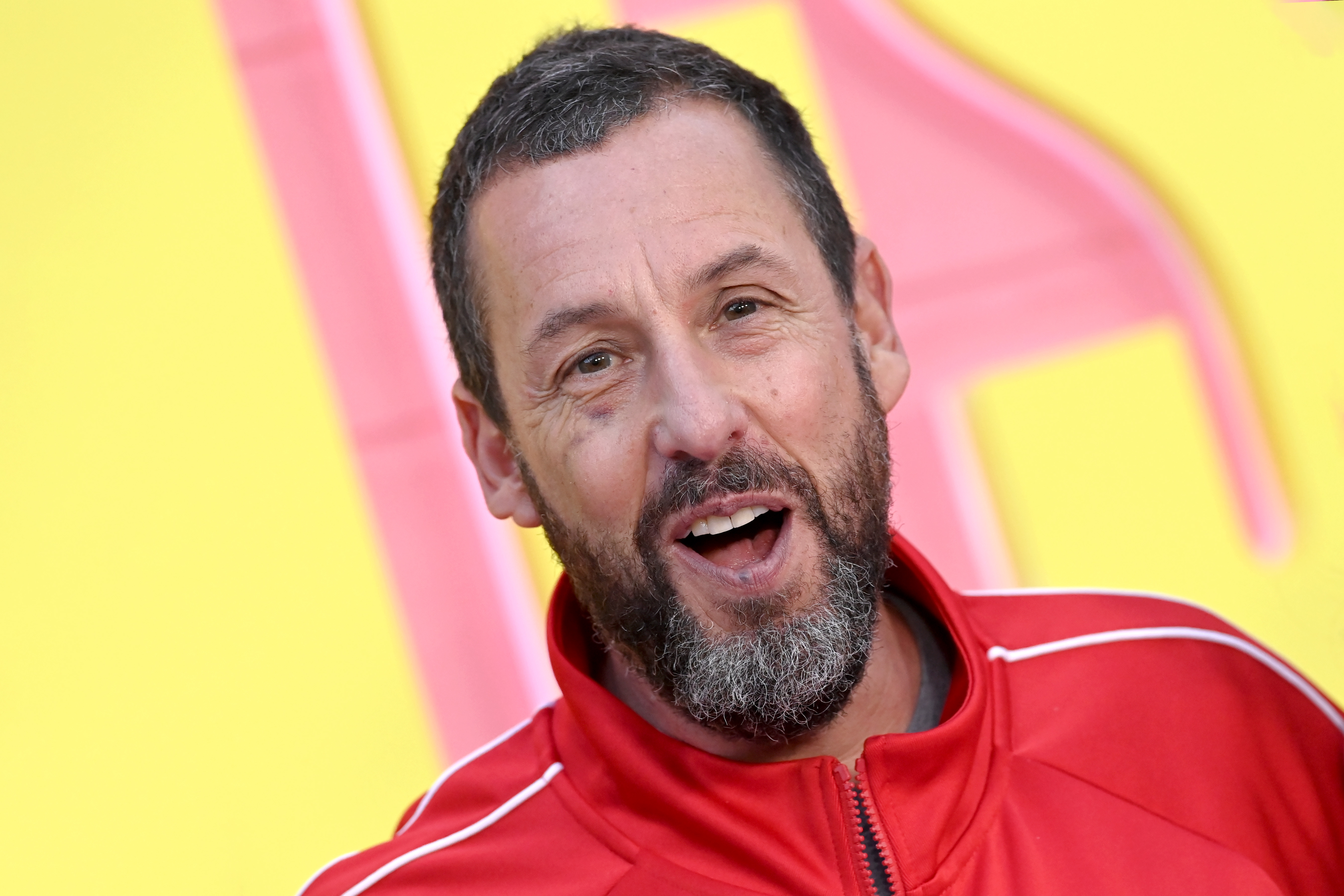 Adam Sandler, pictured at the premiere of "Roommates" in Los Angeles in April 2026, reportedly officiated Taylor Swift and Travis Kelce's wedding, according to Bloomberg and TMZ. Bloomberg later reported that Swift's publicist confirmed Sandler officiated the ceremony. | Source: Getty Images