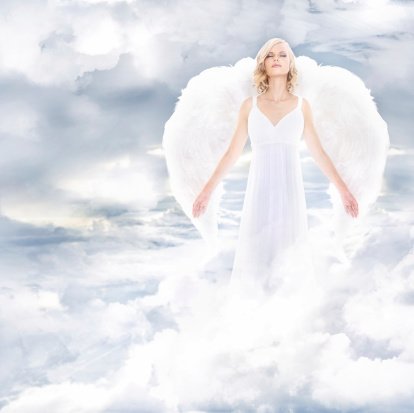 A beautiful angel on clouds | Photo: Getty Images