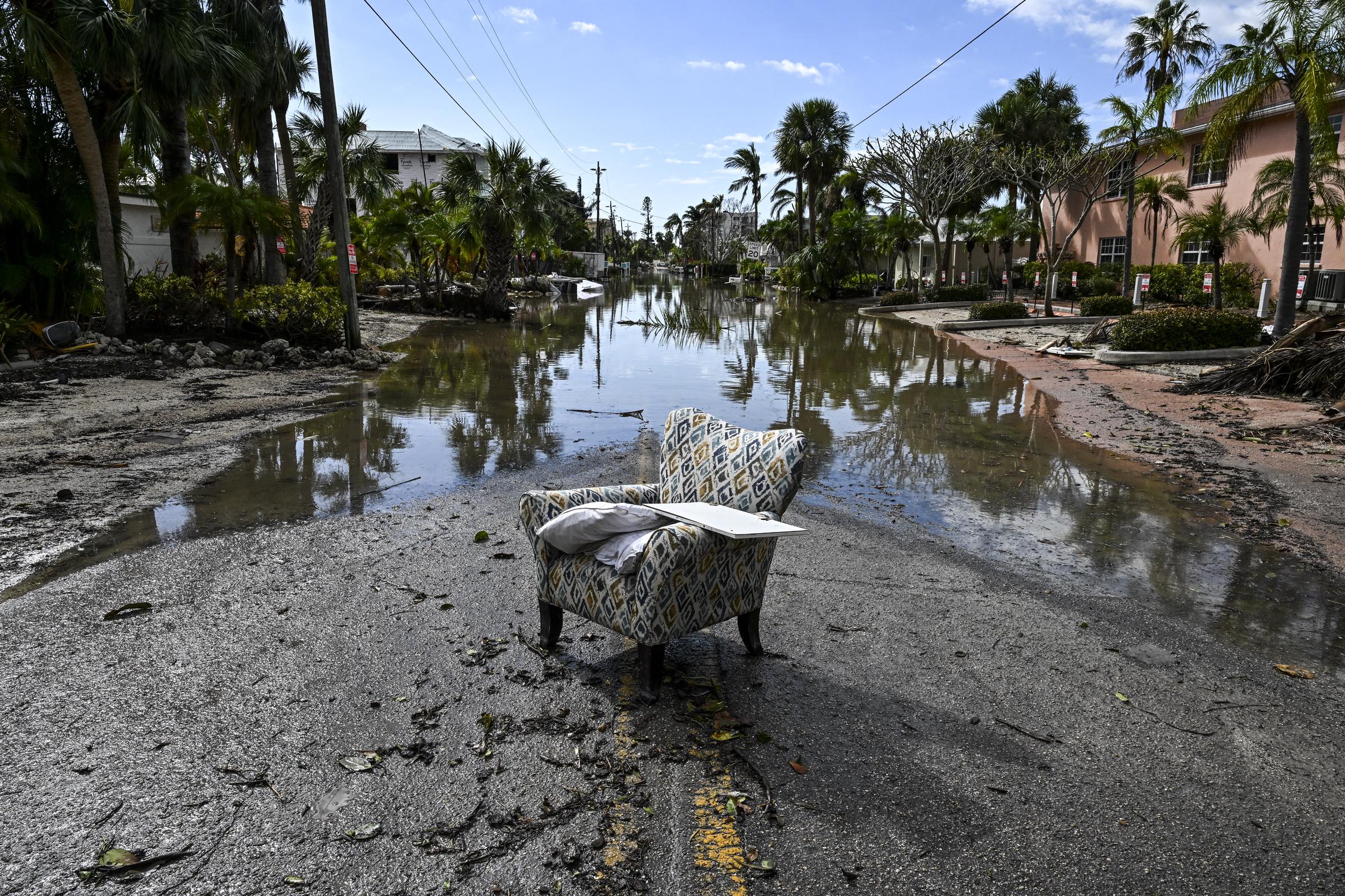 A flooded street with debris in the aftermath of Hurricane Milton, in Siesta Key, Florida, on October 10, 2024 | Source: Getty Images