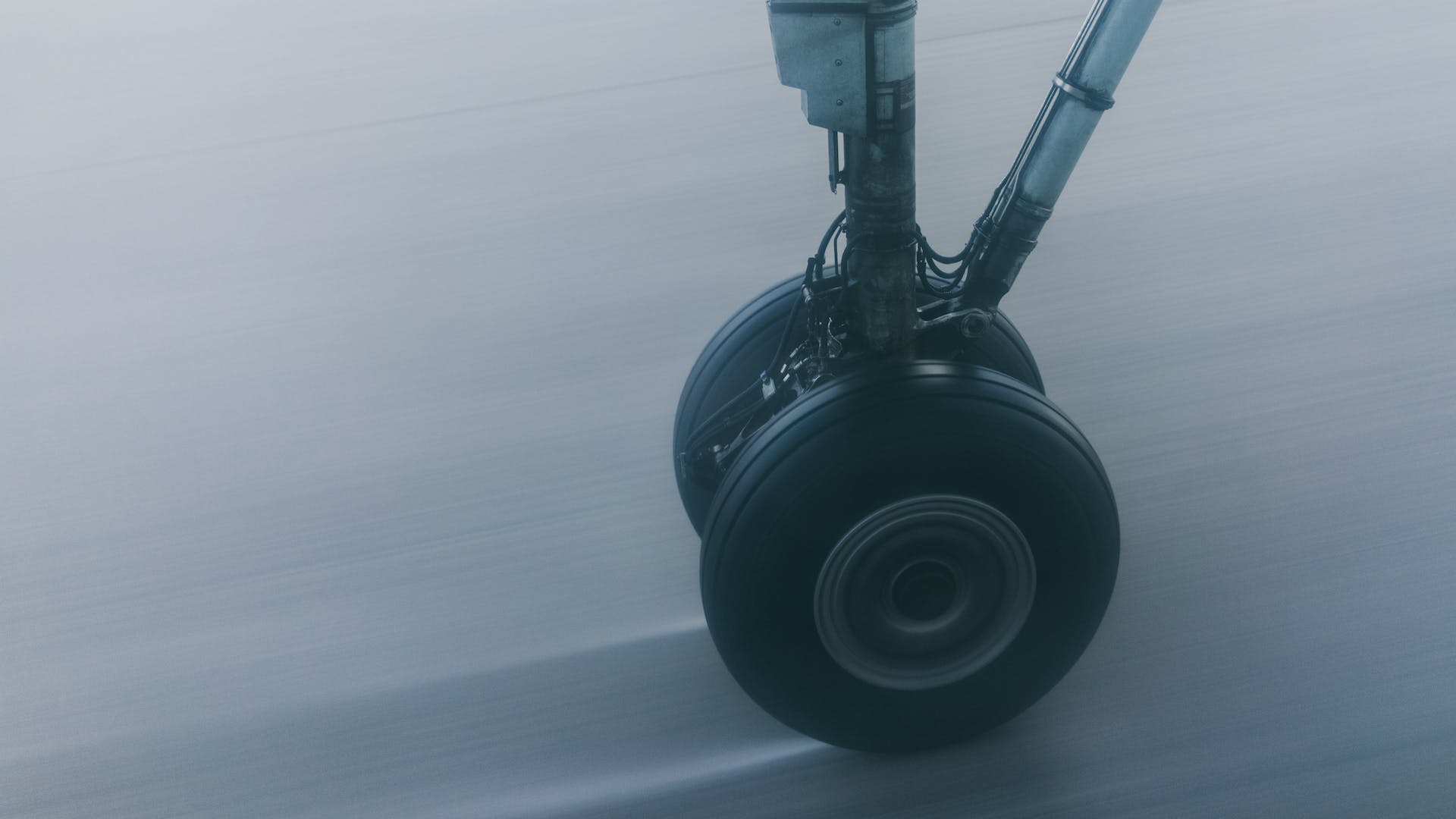 An airplane wheel touching the ground | Source: Pexels