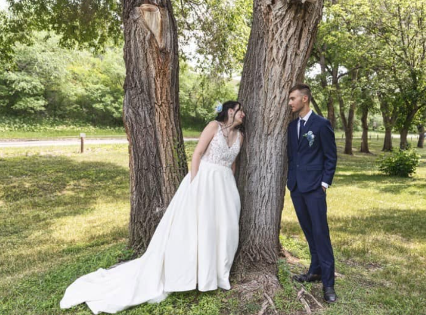 A wedding photo shows Kailey Erhart and her husband, Cameron, posing together outdoors, offering a striking contrast to the difficult circumstances that would later surround their family. | Source: Facebook/Kailey Erhart