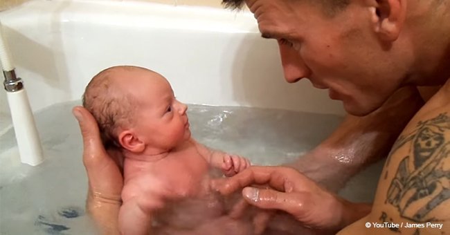 Father baths newborn for the first time and baby girl's reaction goes viral