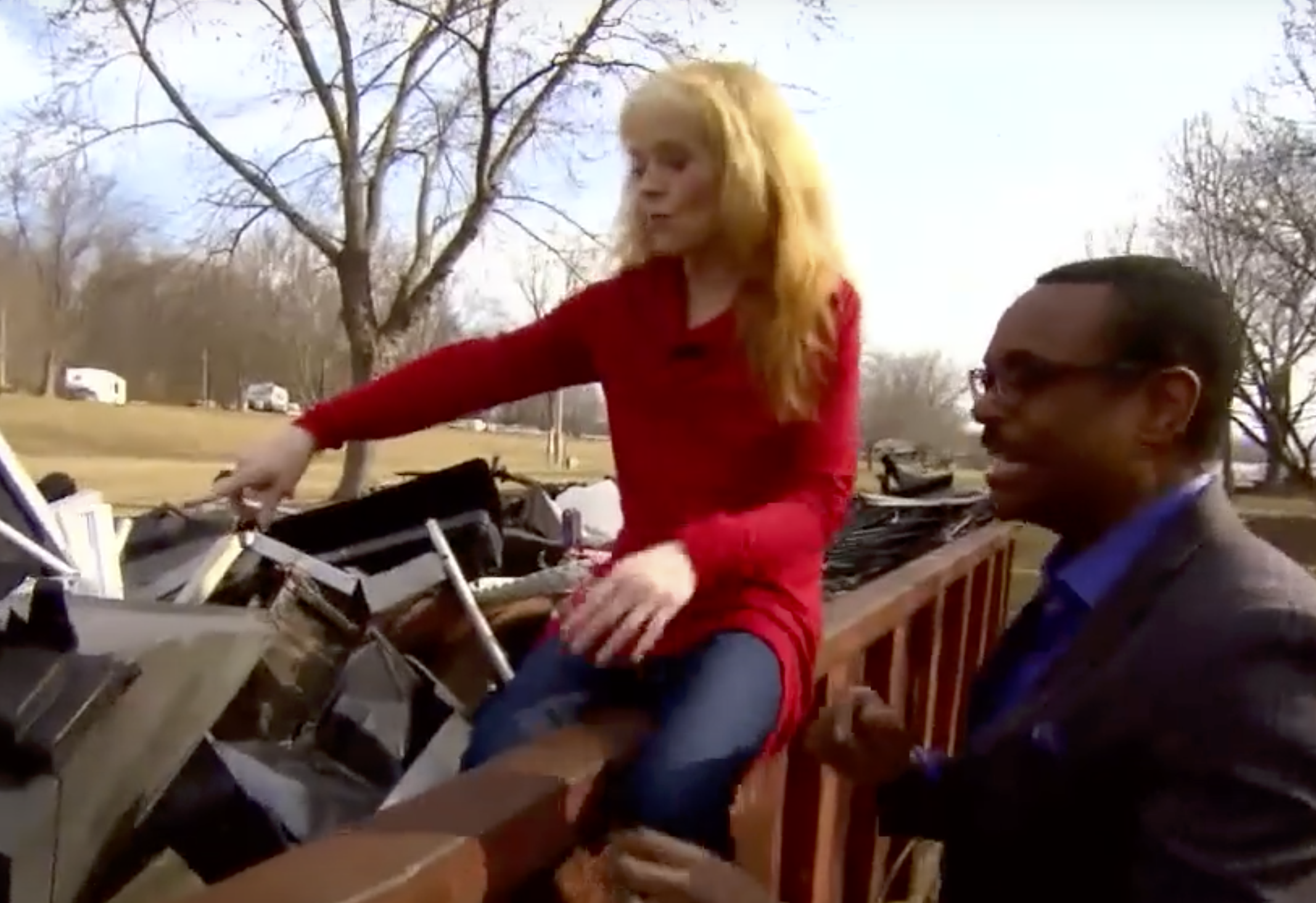 A screenshot of Susan Richardson dumpster diving from a YouTube video dated February 17, 2017. | Source: YouTube/Inside Edition