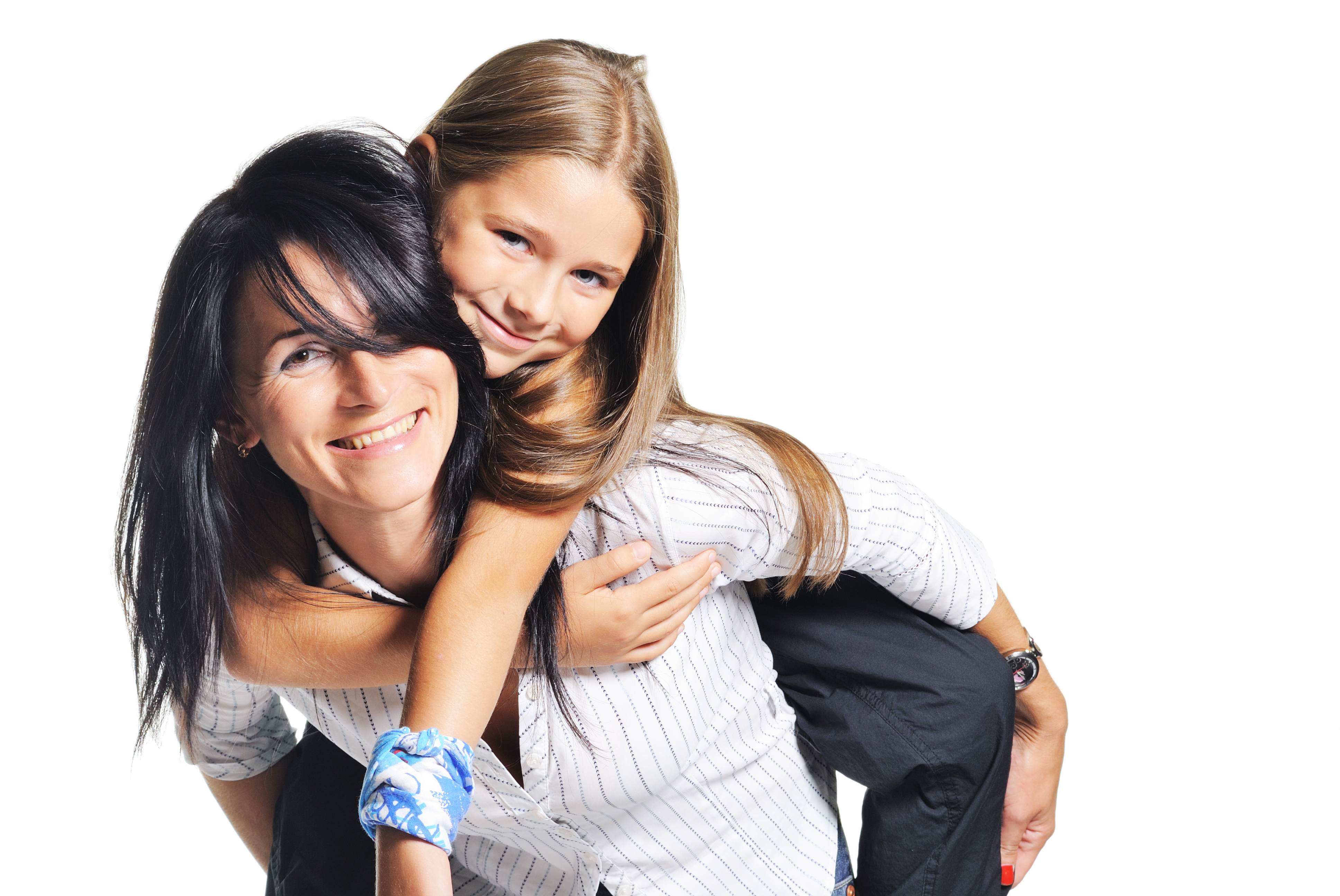 A woman carrying a young girl on her back | Source: Shutterstock