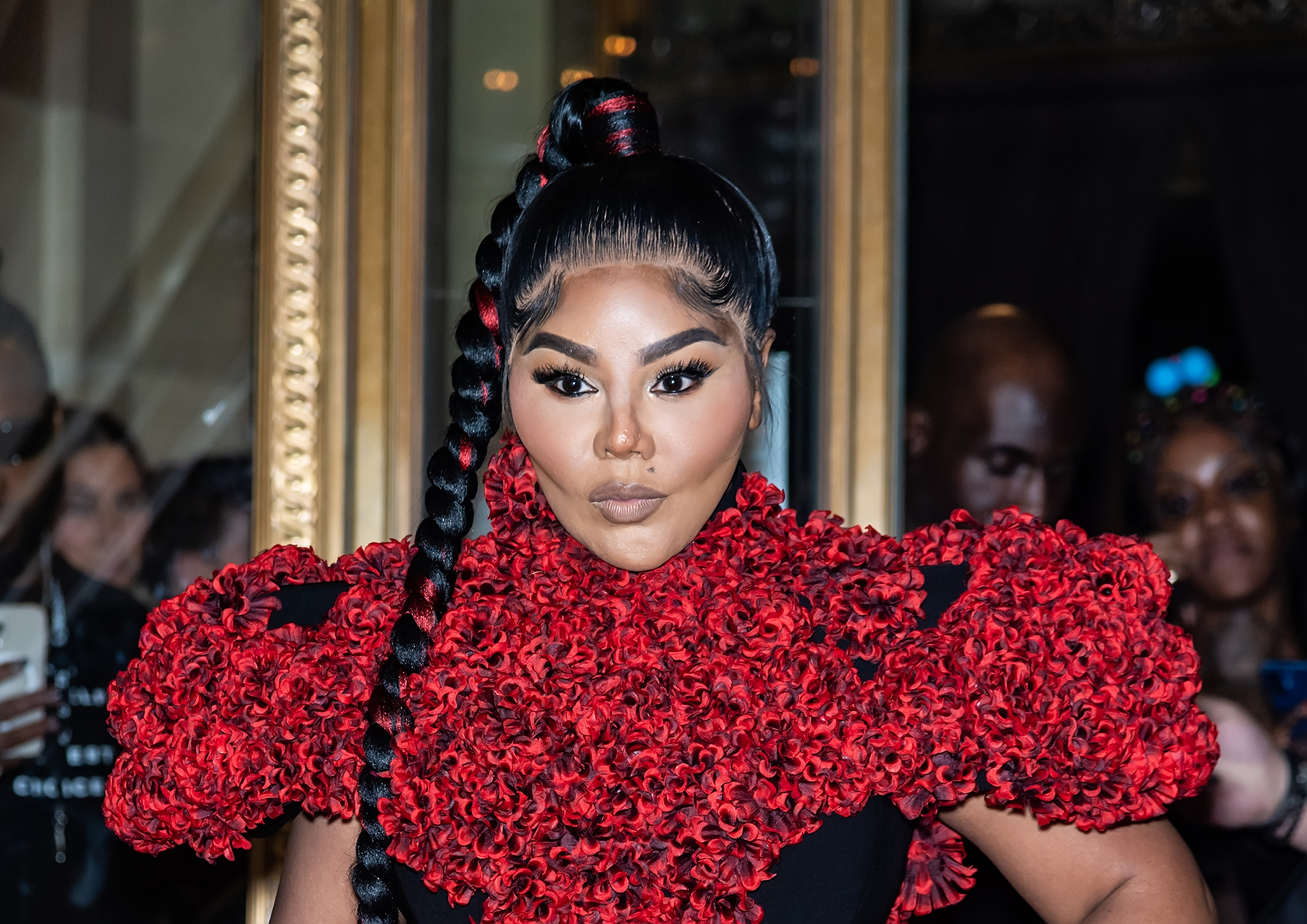 Lil' Kim at Christian Siriano's Spring 2022 show during New York Fashion Week in New York City on September 7, 2021. | Source: Getty Images