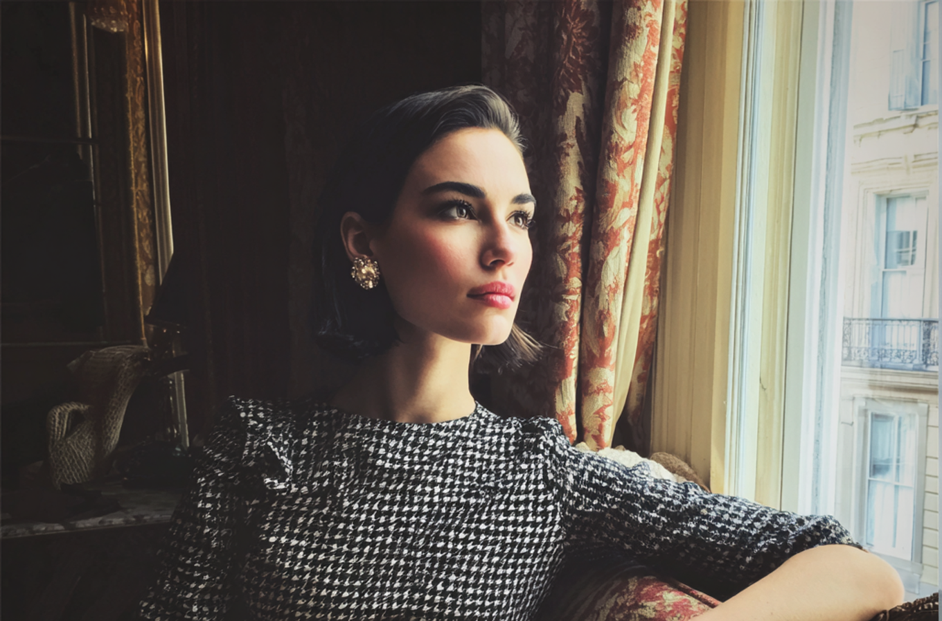 A pensive woman sitting on a couch | Source: Midjourney