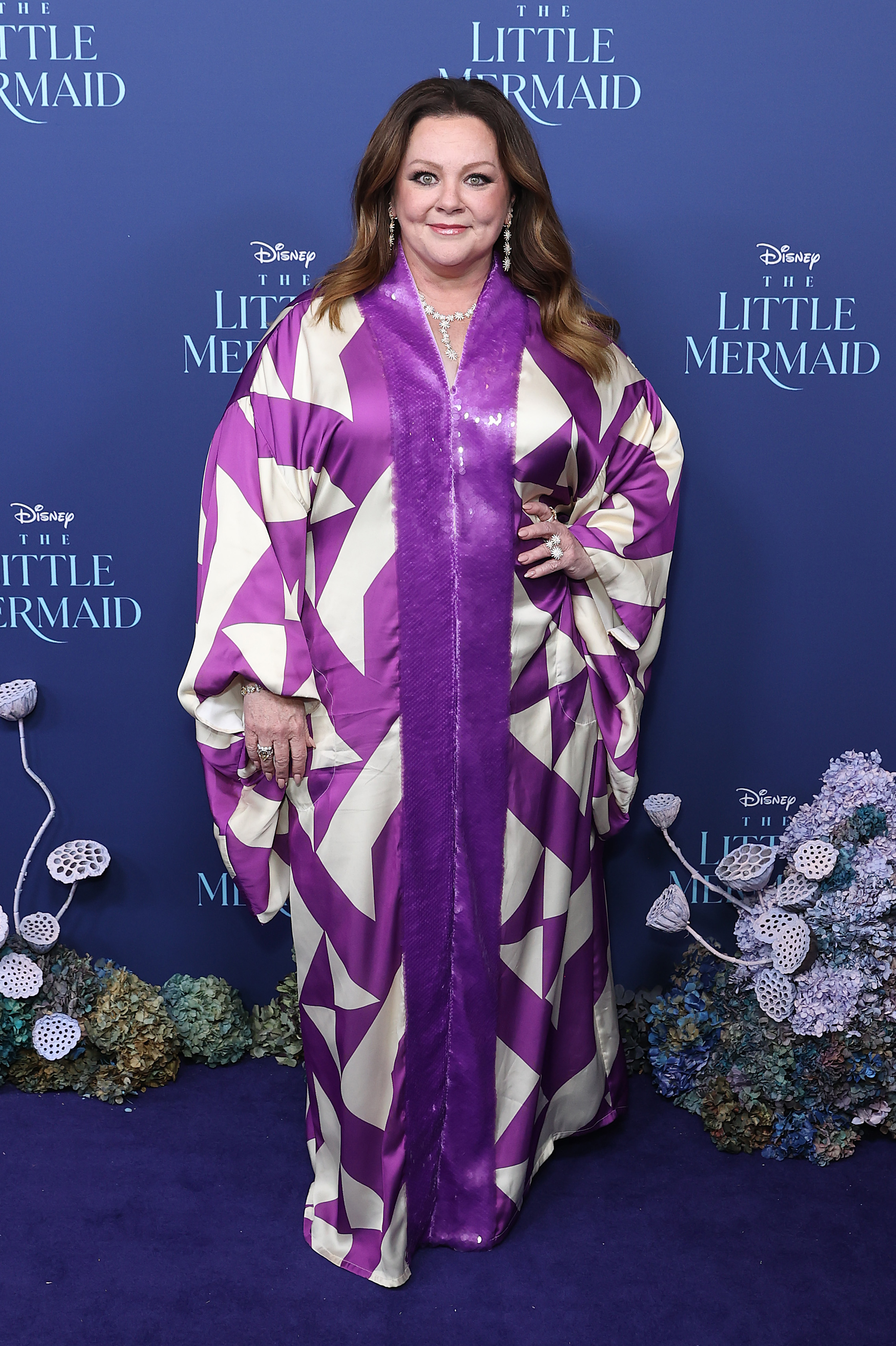 At the Australian premiere of "The Little Mermaid" in Sydney, McCarthy leaned into bold pattern and color, stepping out in a flowing purple look that felt both playful and statement-making.