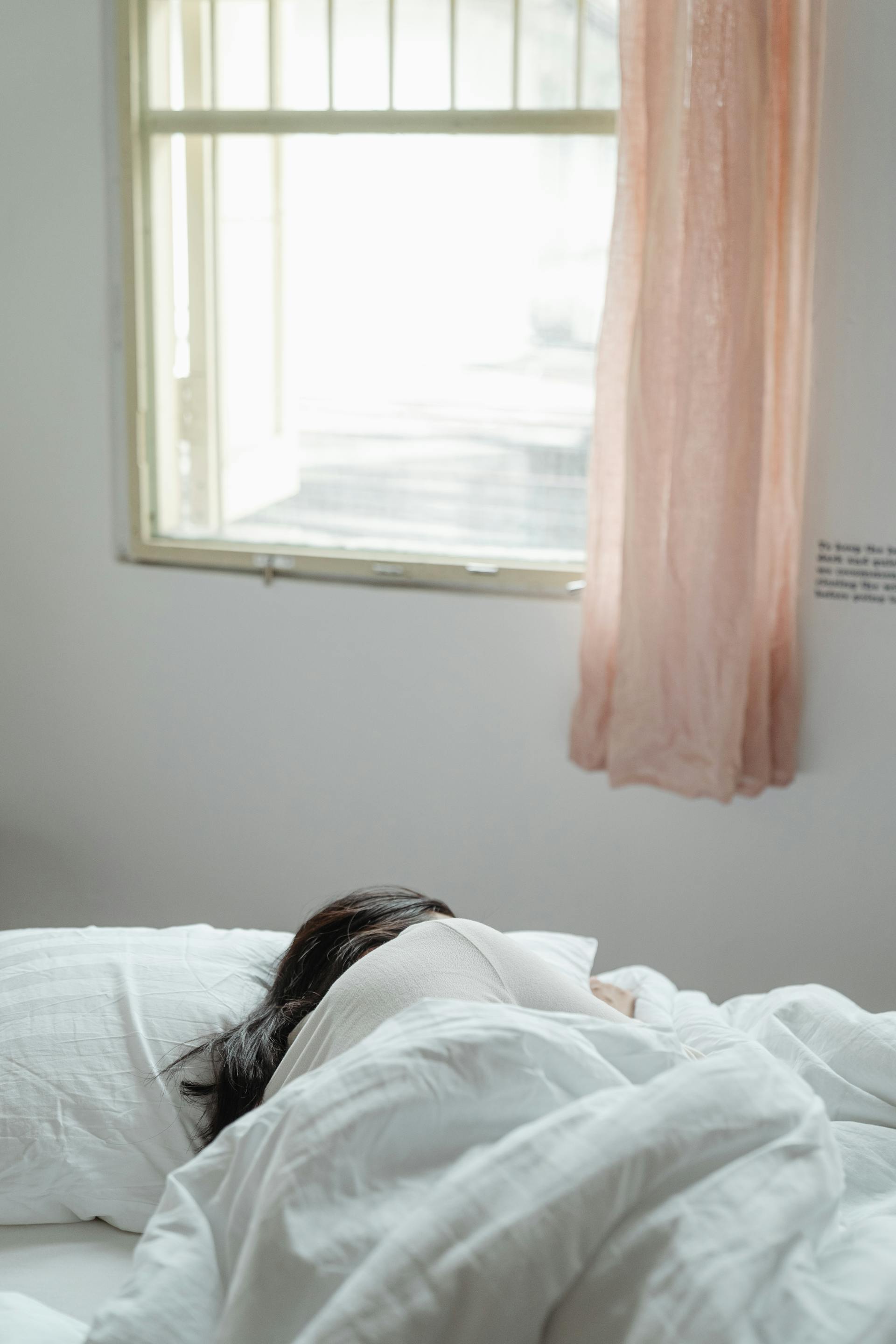 A person sleeping in bed | Source: Pexels