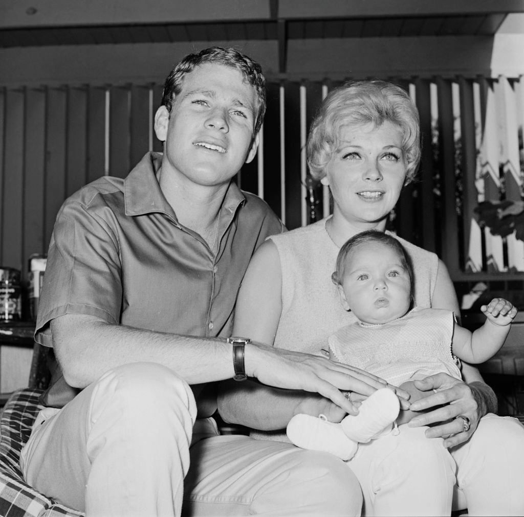Ryan O'Neal, Joanna Moore, and Tatum O'Neal in behind the scenes during the making of the ABC tv series "Peyton Place." | Source: Getty Images