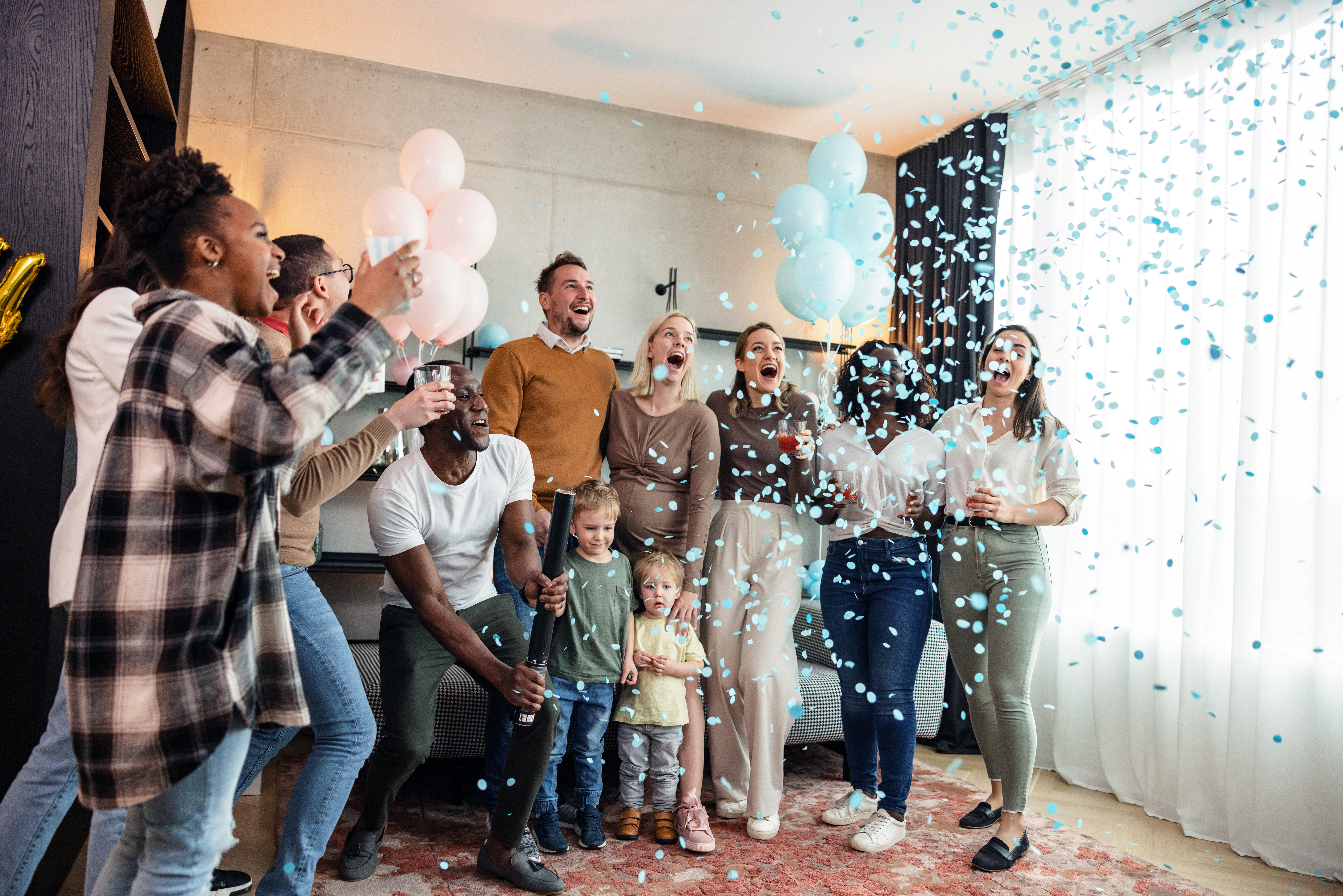Confetti falling at a gender reveal party | Source: Getty Images