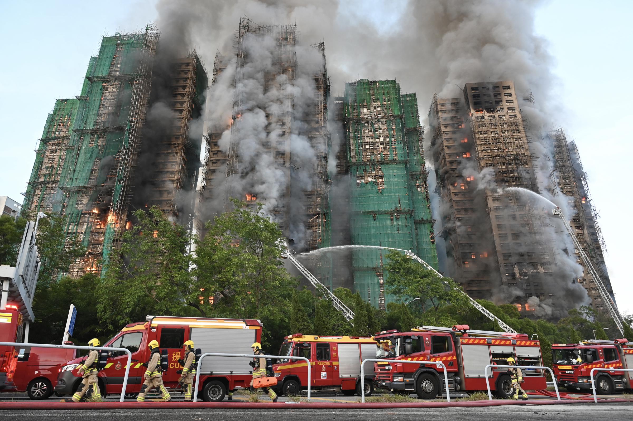 Smoke and flames engulf multiple towers at Wang Fuk Court in Tai Po, Hong Kong, on November 26, 2025 | Source: Getty Images