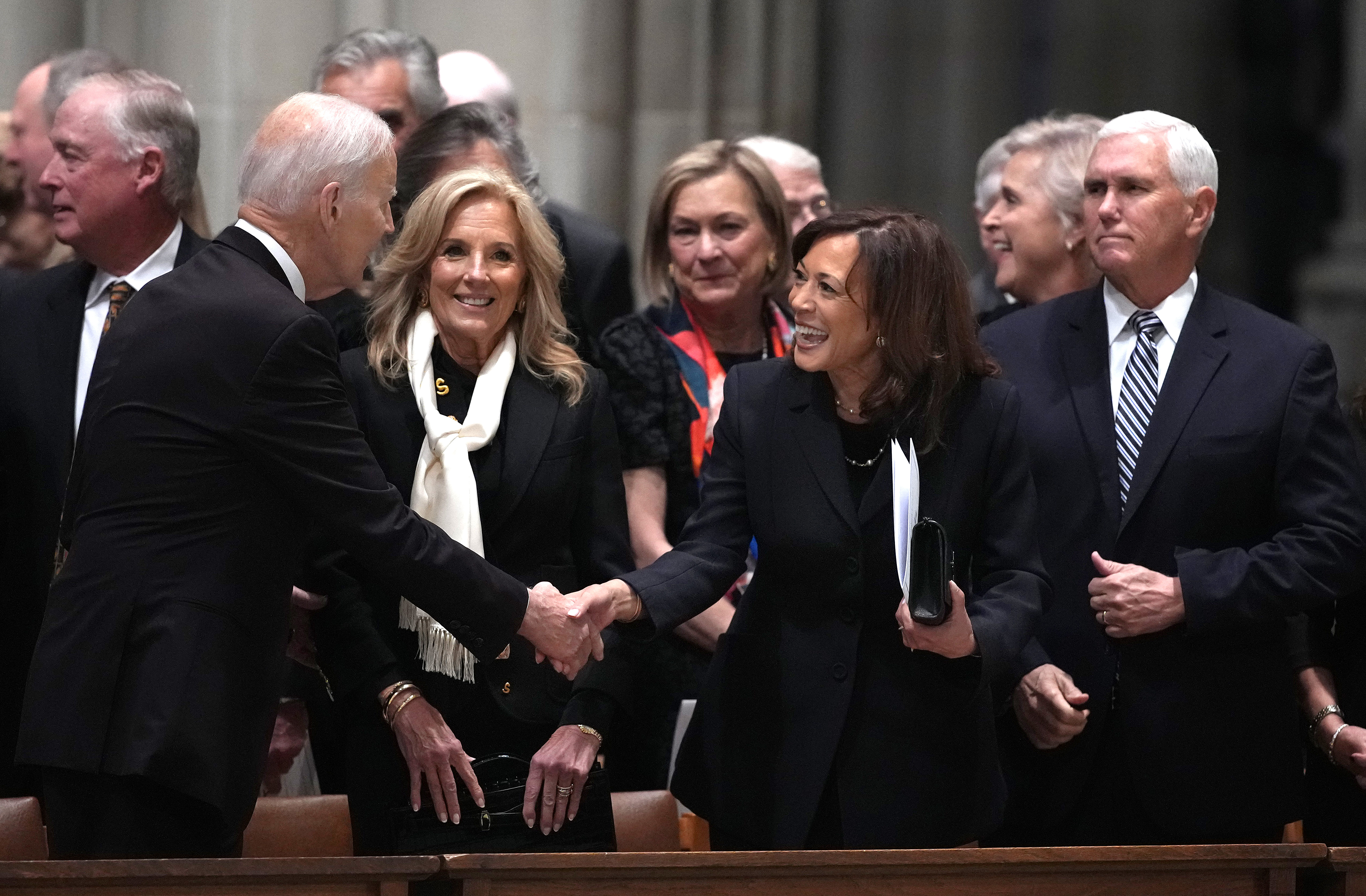 Former President Joe Biden greets Vice President Kamala Harris during the funeral of former Vice President Dick Cheney, as former First Lady Jill Biden and former Vice President Mike Pence look on | Source: Getty Images