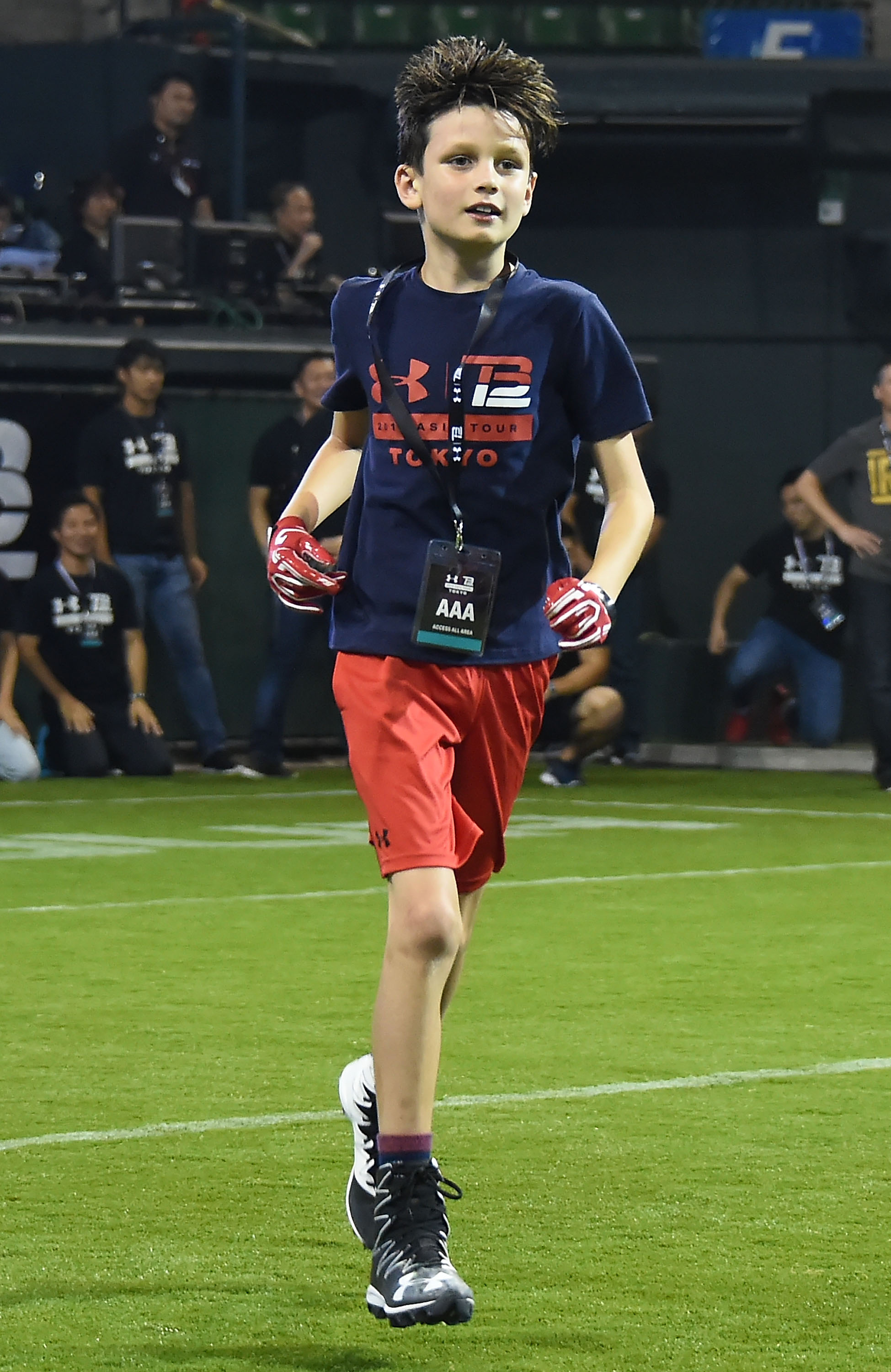 Jack Moynahan takes to the field at the Under Armour Tom Brady Asia Tour in Tokyo, confidently running across Ariake Colosseum during the 2017 event.