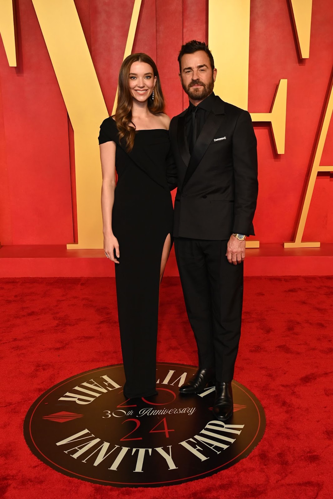 Nicole Brydon Bloom and Justin Theroux posing together | Source: Getty Images