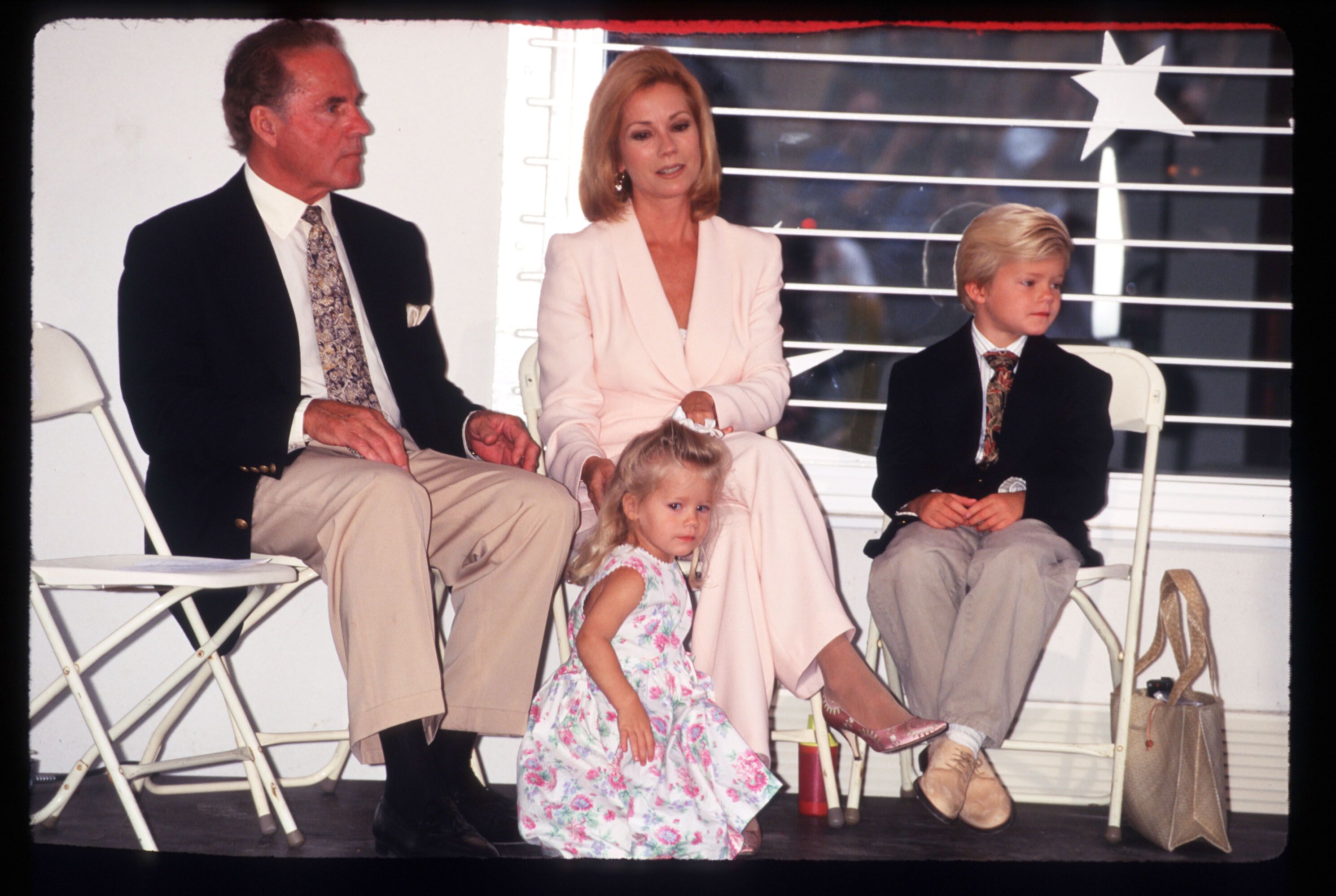 Frank and Kathie Lee Gifford sit with their children, Cody and Cassidy, at the dedication of Cassidy's Place on June 10, 1996, in New York City | Photo: Evan Agostini/Liaison/Getty Images