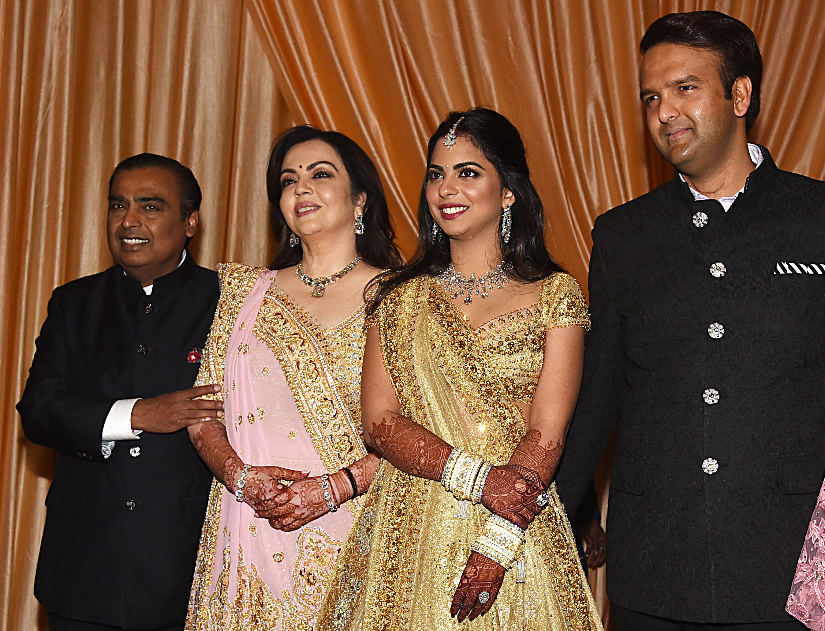 Mukesh and Nita Ambani with their daughter Isha and Anand Piramal during Isha and Anand's wedding reception in Mumbai, India on December 14, 2018 | Source: Getty Images