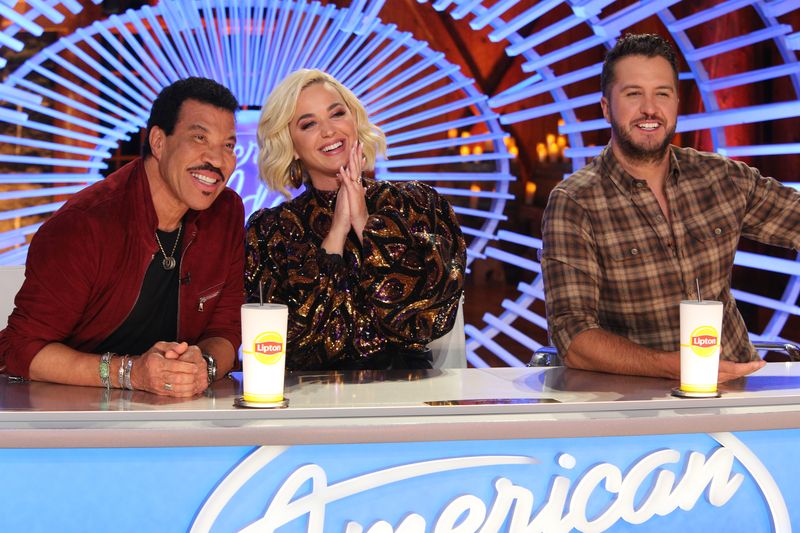 'American Idol' judges Lionel Richie, Katy Perry, and Luke Bryan at the judges' table during show auditions | Photo: Getty Images