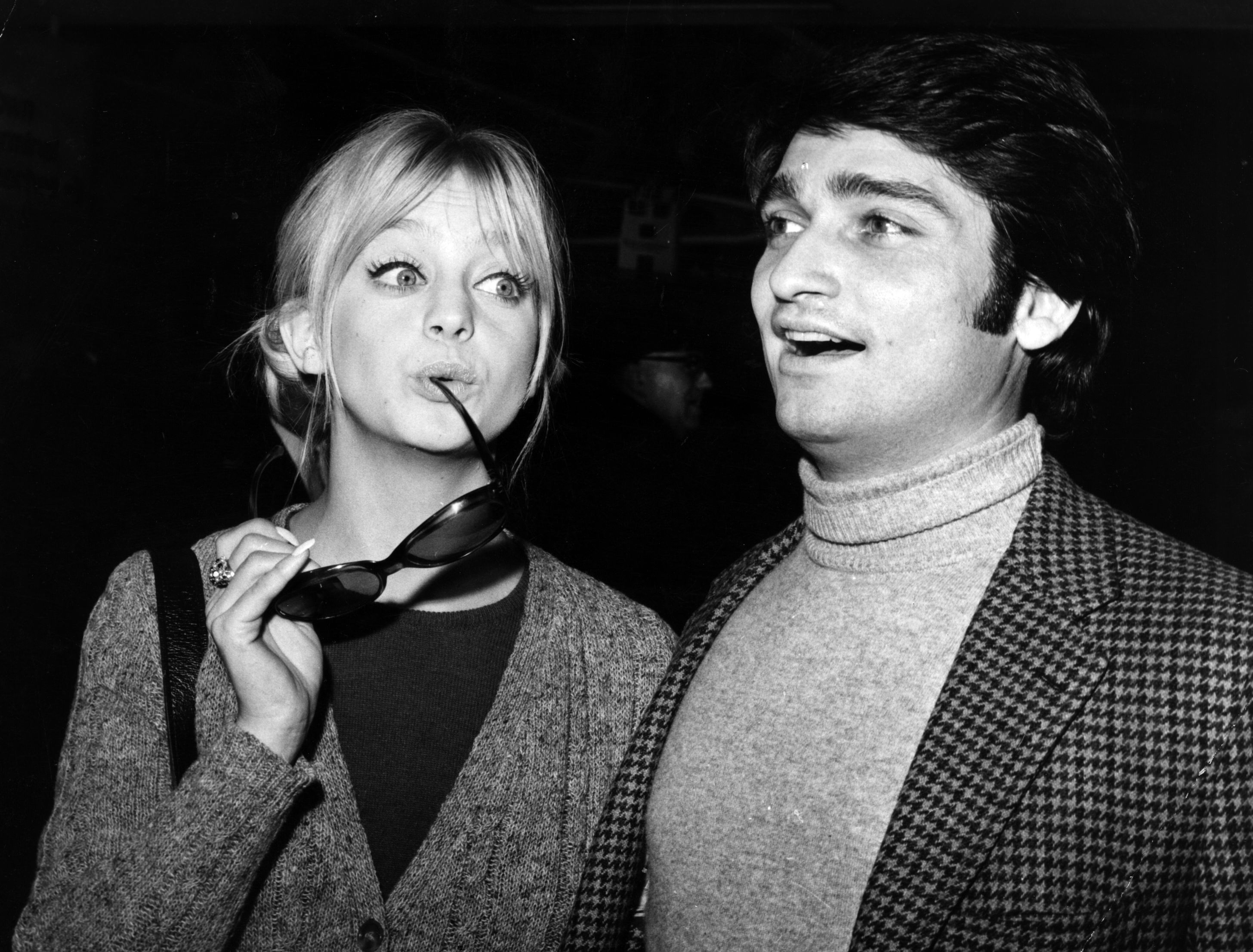 Goldie Hawn, one of the stars of the American TV show, 'Rowan and Martin's Laugh-In' on a visit to England. She is acompanied by her husband, Gus Trikonis. 28th January 1970 | Source: Getty Images 