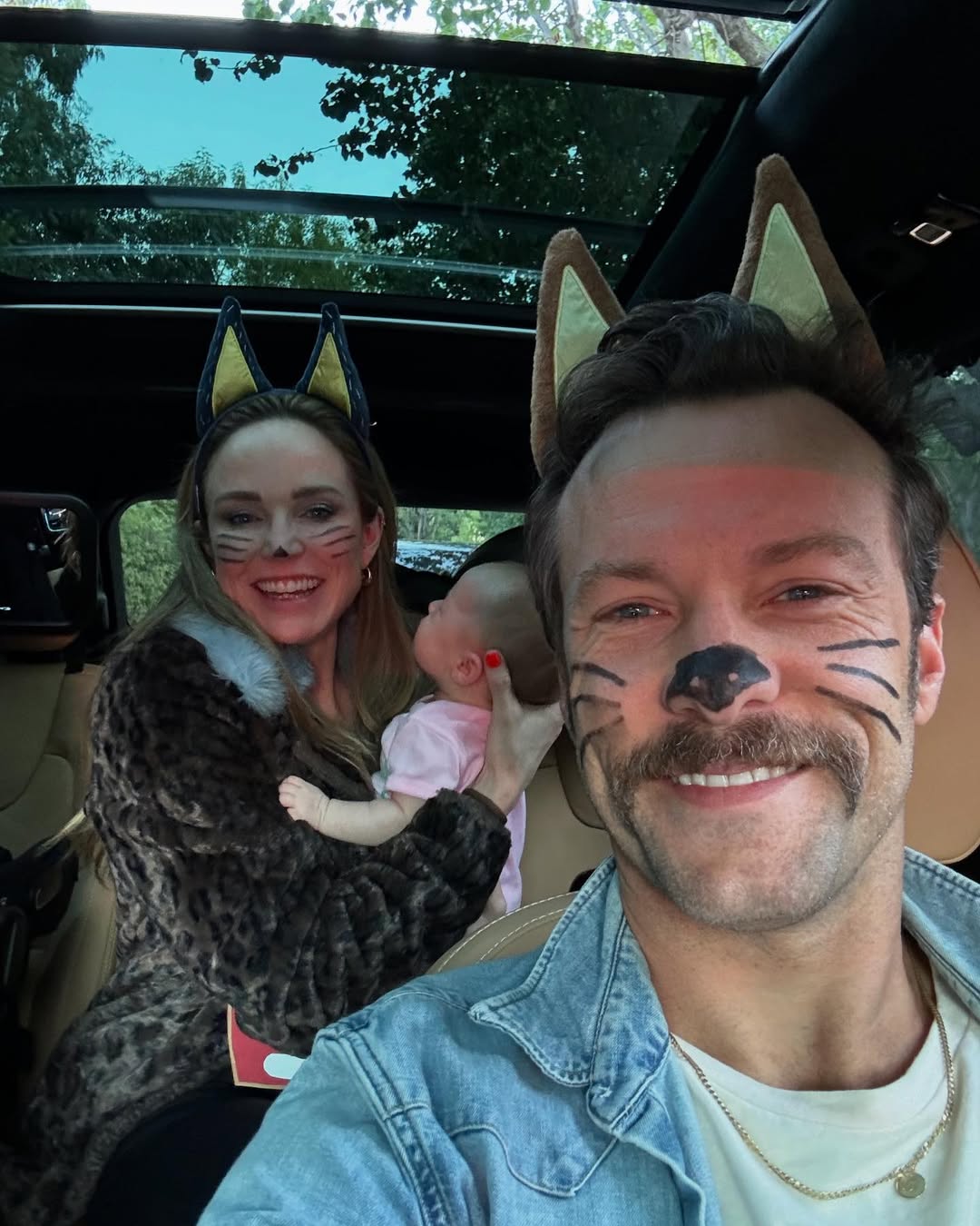 Caity Lotz and Kyle Schmid with their daughter from a post dated December 31, 2024. | Source: Instagram/iamkyleschmid