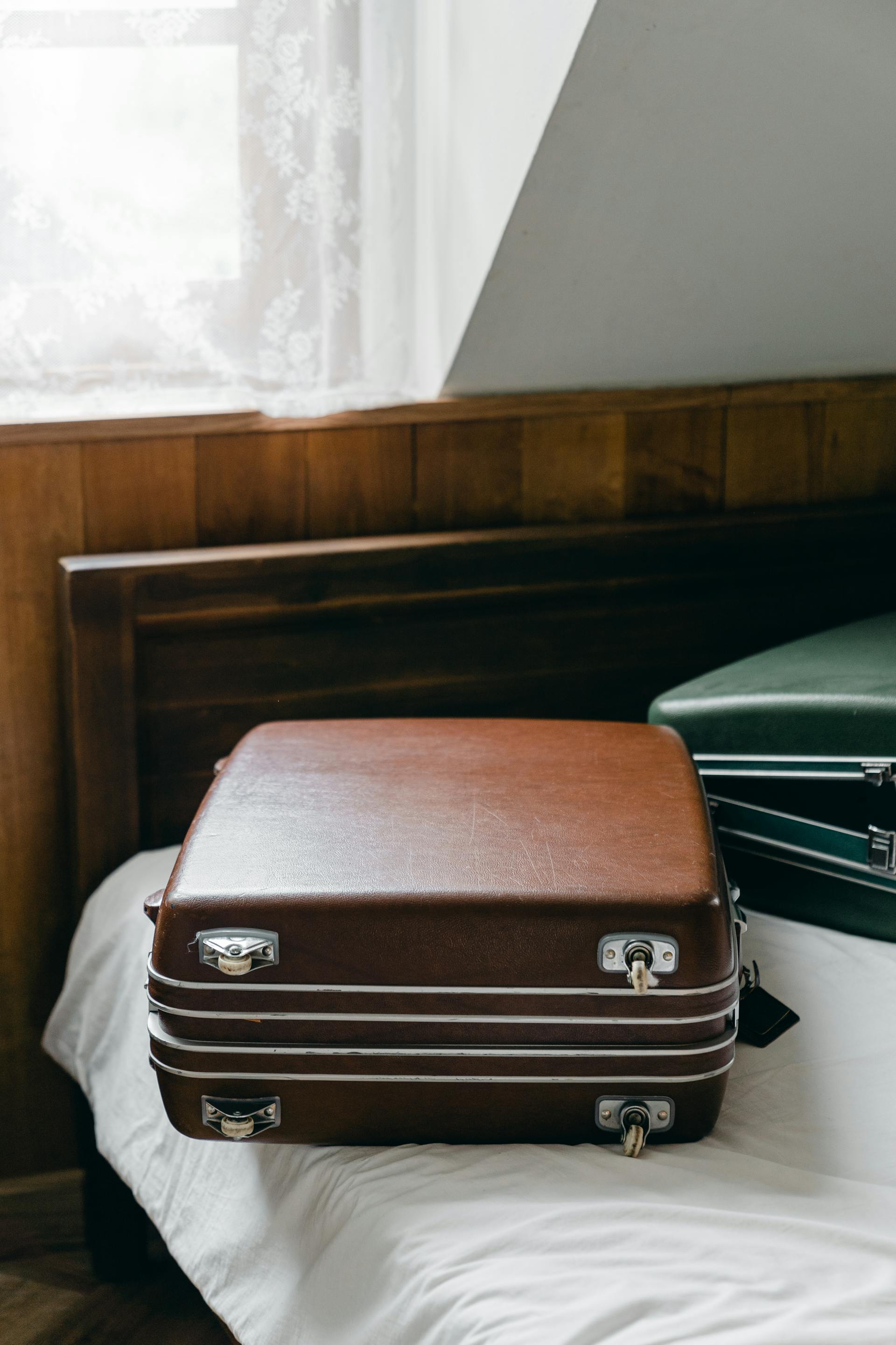 Suitcases on a bed | Source: Pexels