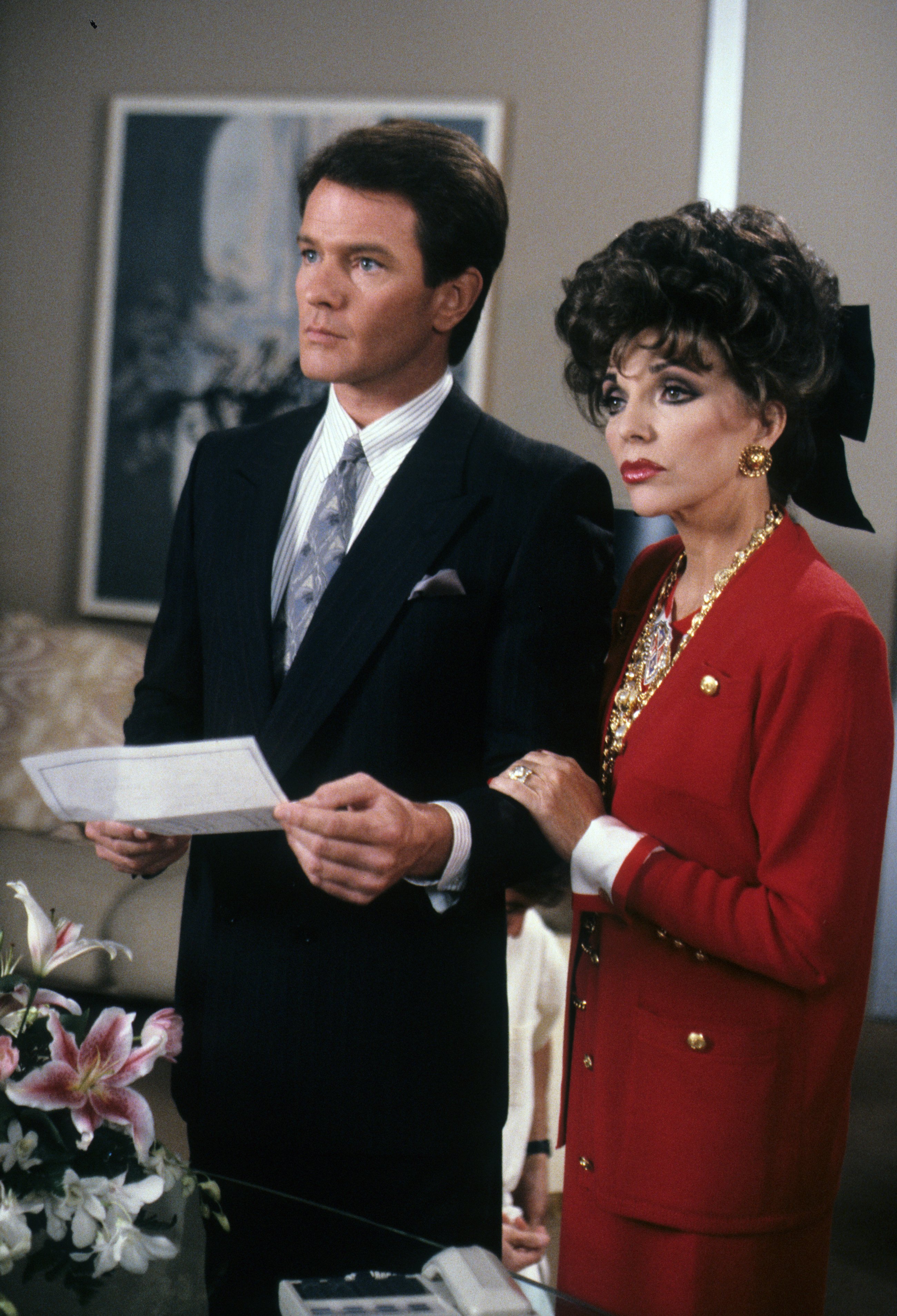 Gordon Thomson and Joan Collins on an episode of "Dynasty" on April 5, 1989 | Source: Getty Images