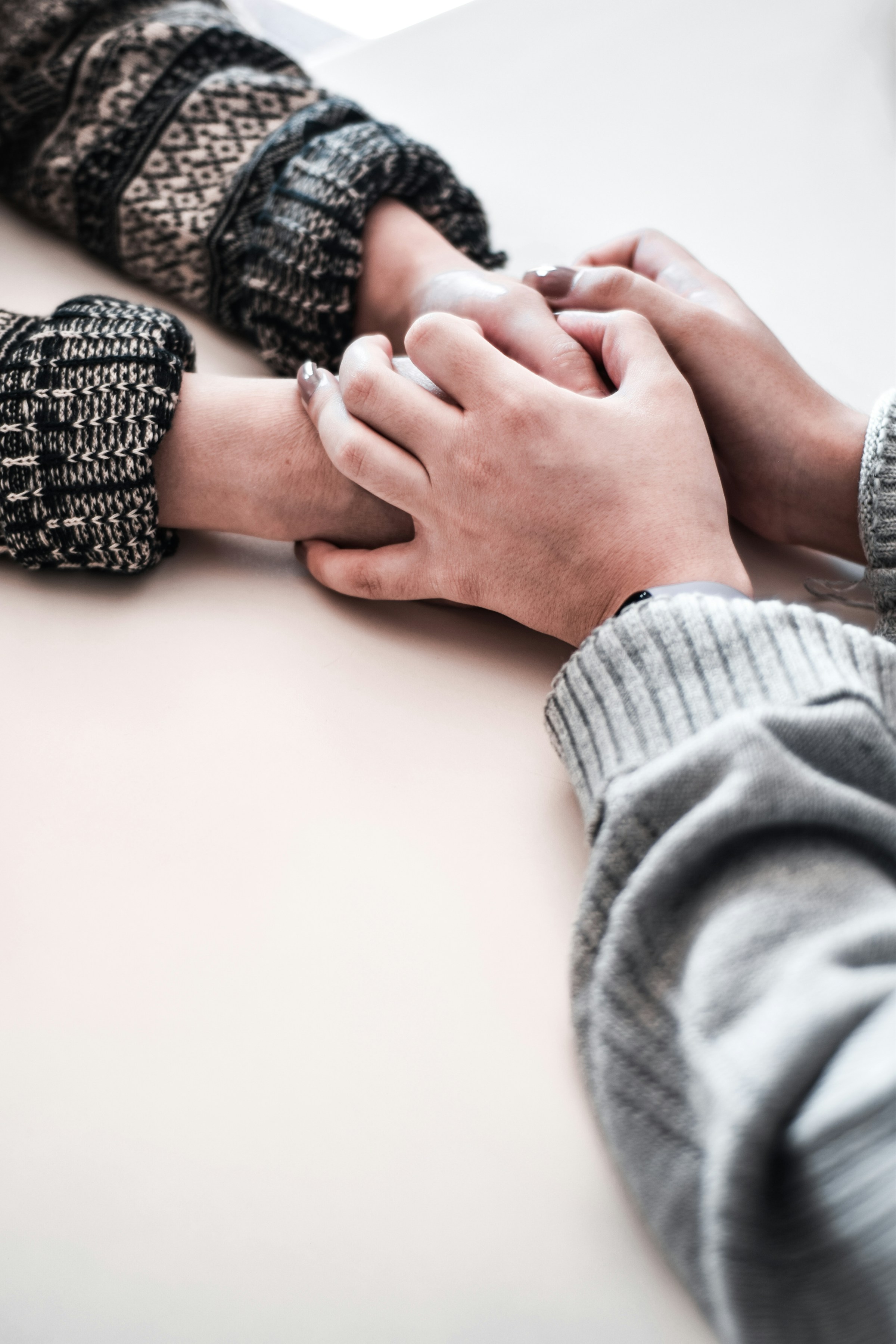 A pair of people holding hands | Source: Unsplash
