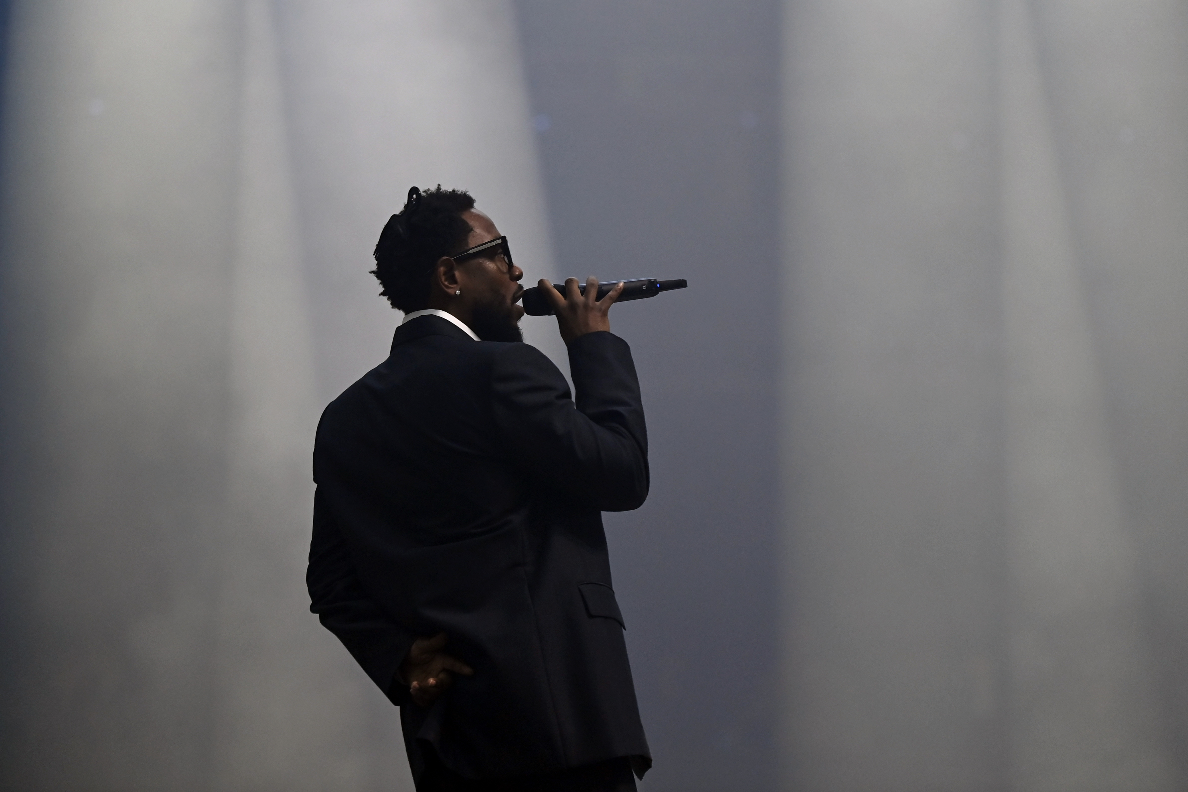 Kendrick Lamar performing onstage during the Visa Cash App RB Formula One Team Livery Reveal in Las Vegas, Nevada on February 8, 2024. | Source: Getty Images