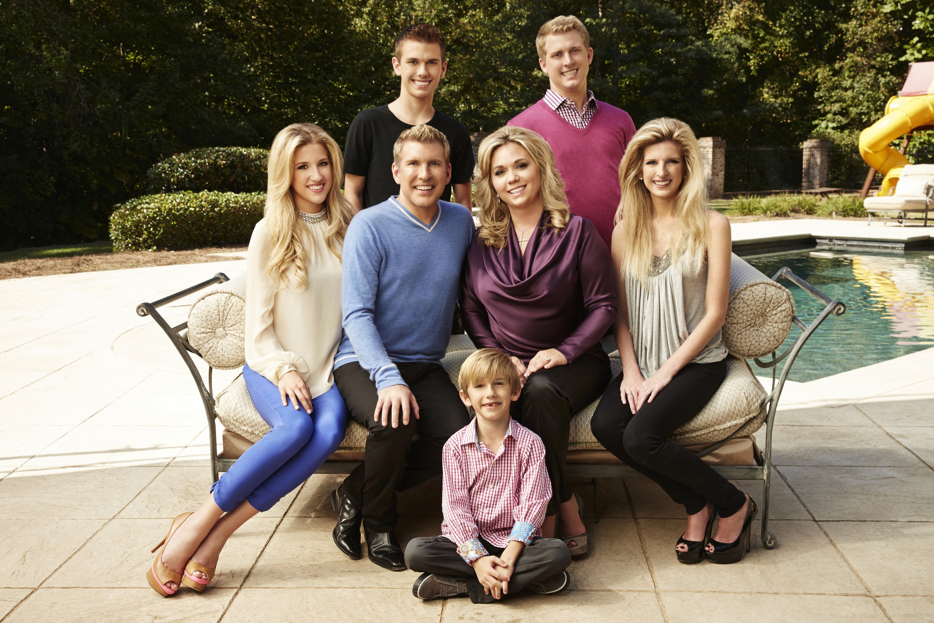 Savannah Chrisley, Todd Chrisley, Chase Chrisley, Grayson Chrisley, Julie Chrisley, Kyle Chrisley, Lindsie Chrisley Campbell on Season One of "Chrisley Knows Best" in October 2013 | Source: Getty Images 