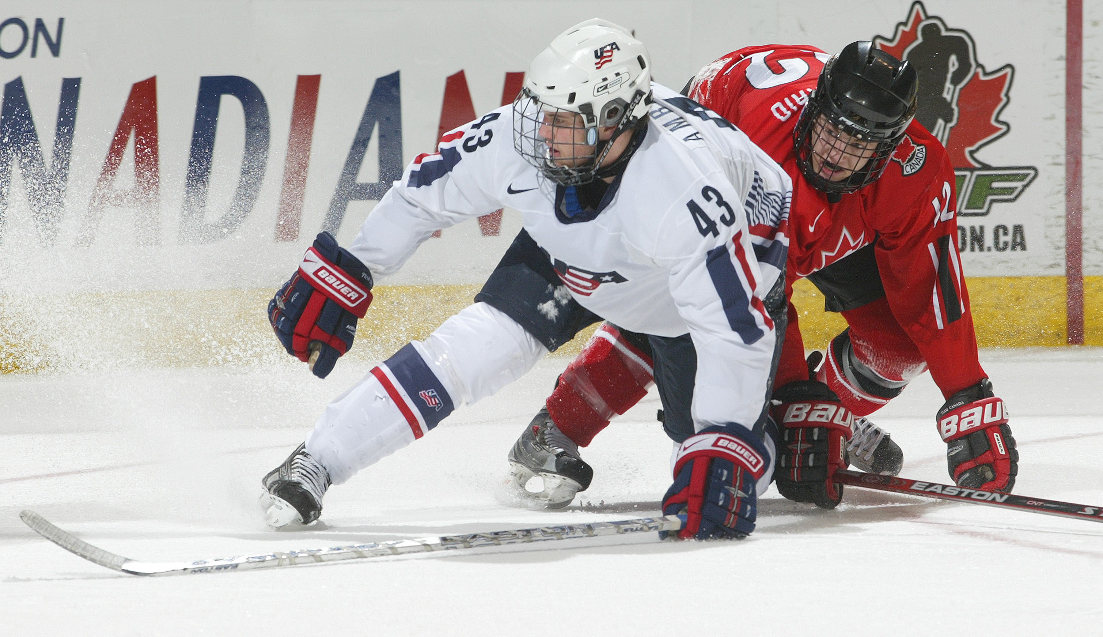 Tyler Amburgey #43 of Team USA collides with Peter Holland #12 of Team Ontario in a game at the John Labatt Centre on January 4, 2008, in London, Ontario | Photo: Claus Andersen/Getty Images
