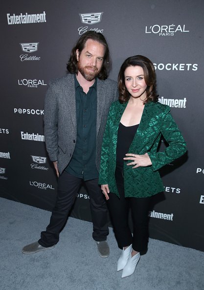 Rob Giles (L) and Caterina Scorsone attend Entertainment Weekly Celebrates Screen Actors Guild Award Nominees sponsored by L'Oreal Paris, Cadillac, And PopSockets at Chateau Marmont on January 26, 2019, in Los Angeles, California. | Source: Getty Images.
