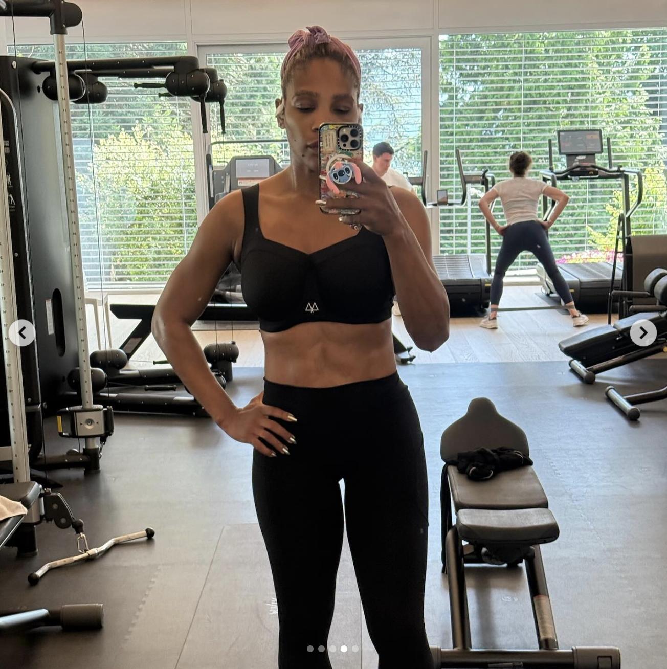With a calm expression, Serena Williams stood in front of the mirror, phone in hand, capturing a close-up of her midsection and upper body. Her nails were painted in a pale shade that stood out subtly against her gym attire.