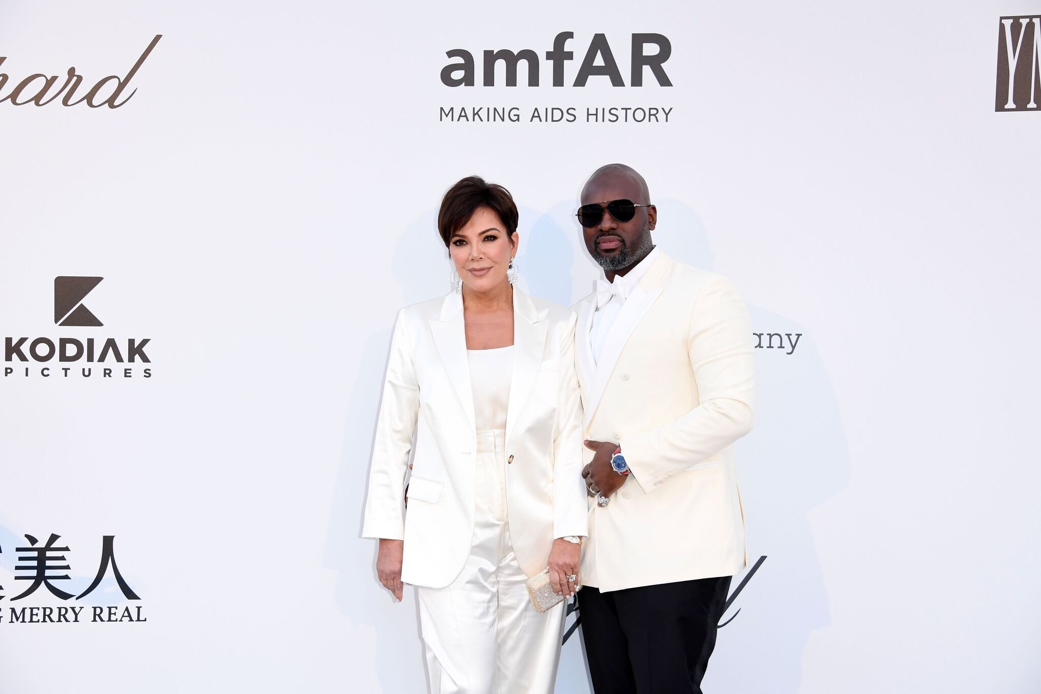 Kris Jenner and boyfriend Corey Gamble wearing matching white outfits at the 2019 amfAR Cannes Gala. I Image: Getty Images.