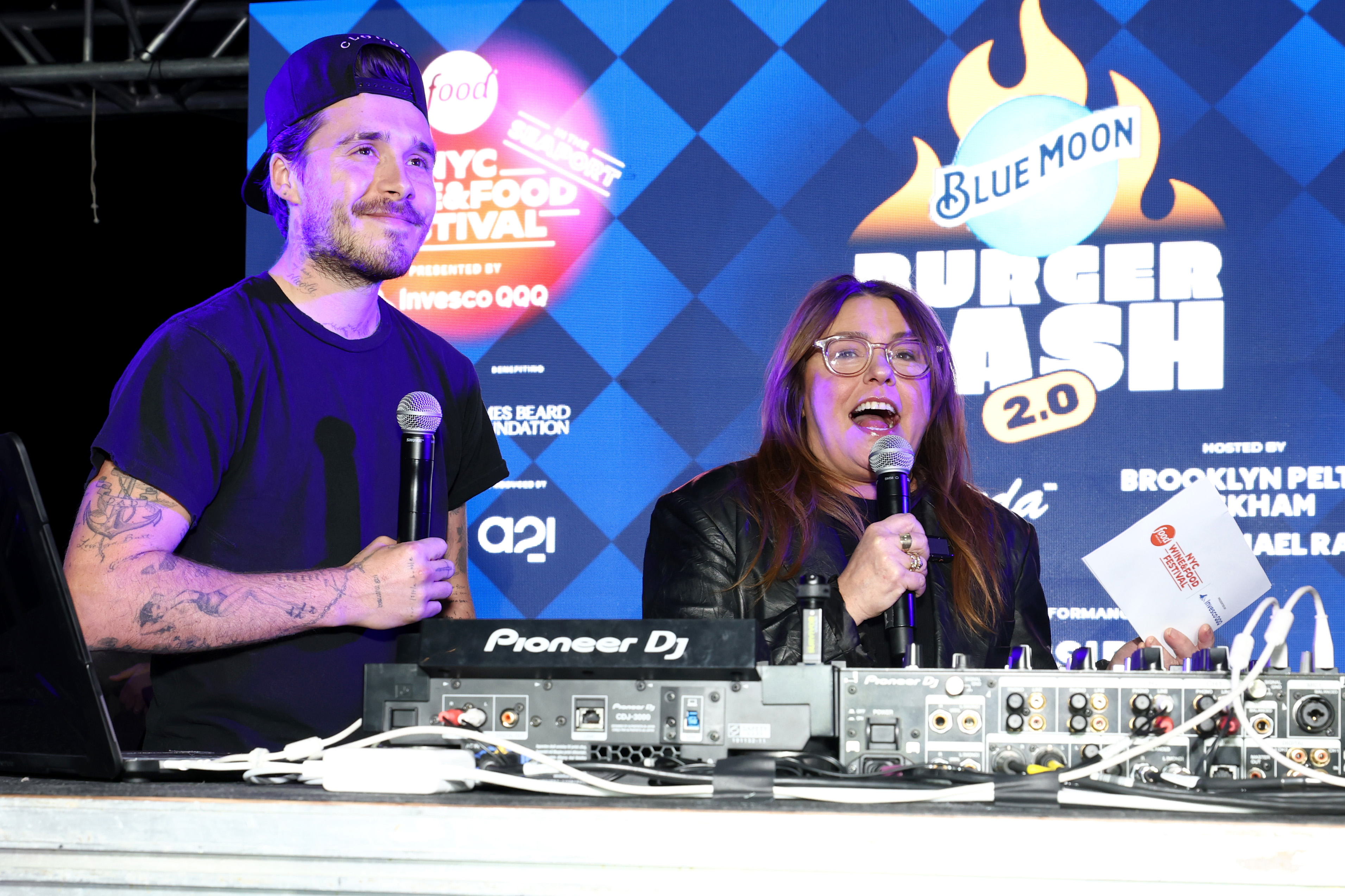 Rachael Ray speaks on stage alongside Brooklyn Beckham while co-hosting the Blue Moon Burger Bash 2.0 on October 17, 2025 | Source: Getty Images