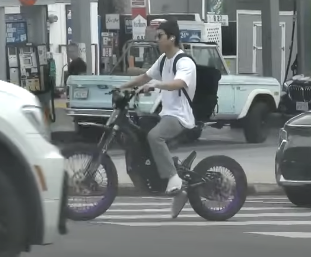 Screenshot of Pax Jolie riding his motorcycle in Los Angeles without a helmet | Source: Youtube/Entertainment Tonight