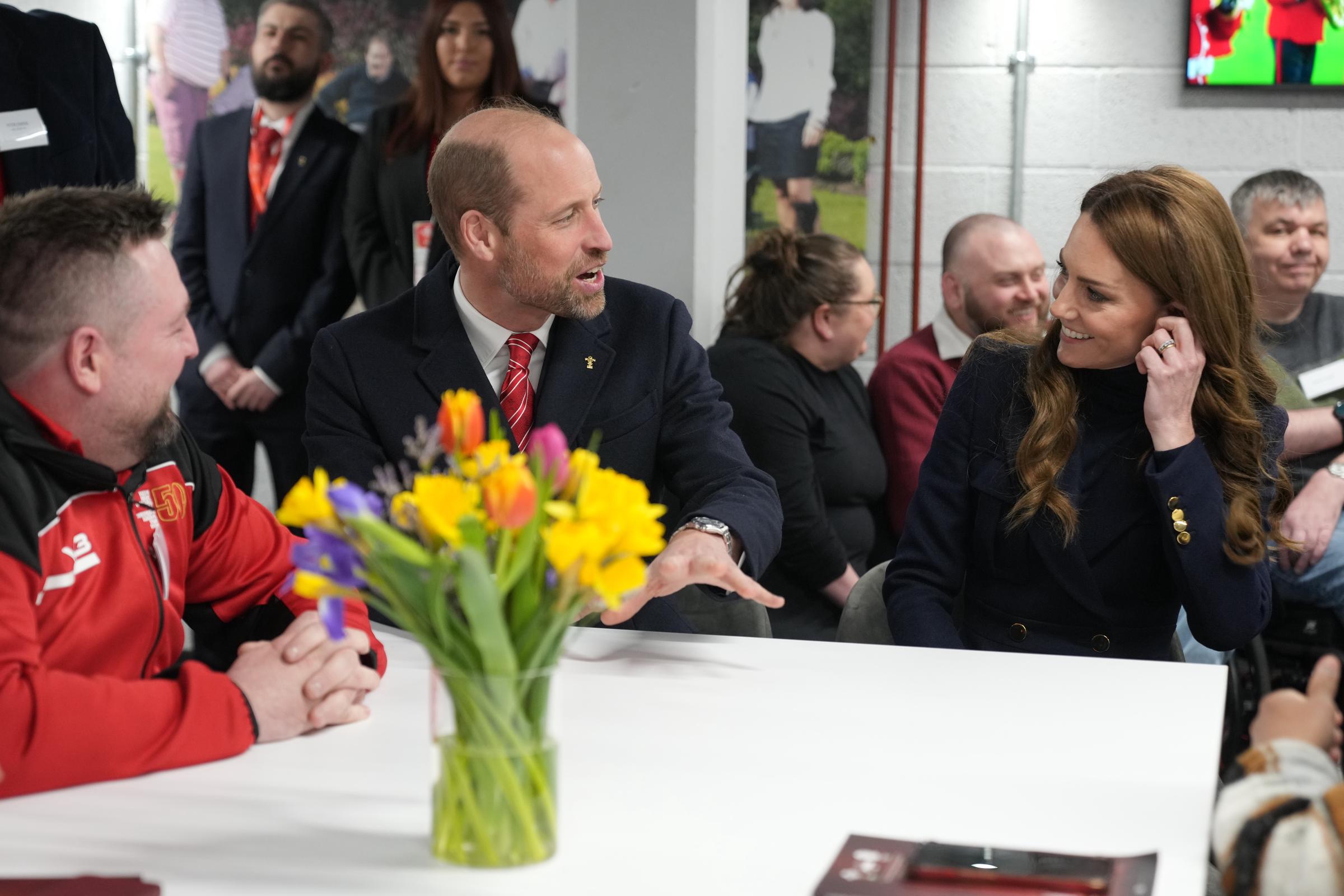 Prince William and Princess Catherine speaking during their meeting with injured players who are supported by the Welsh Rugby Charitable Trust in Cardiff, Wales on March 15, 2025. | Source: Getty Images